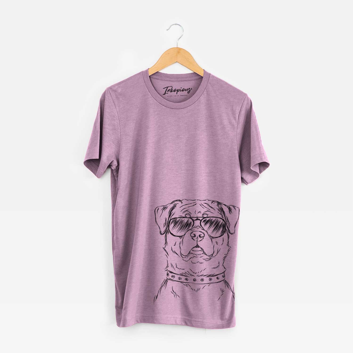 Hand-drawn sketch of Rocky the Rottweiler wearing aviator sunglasses on an Orchid Bella Canvas Unisex Crewneck