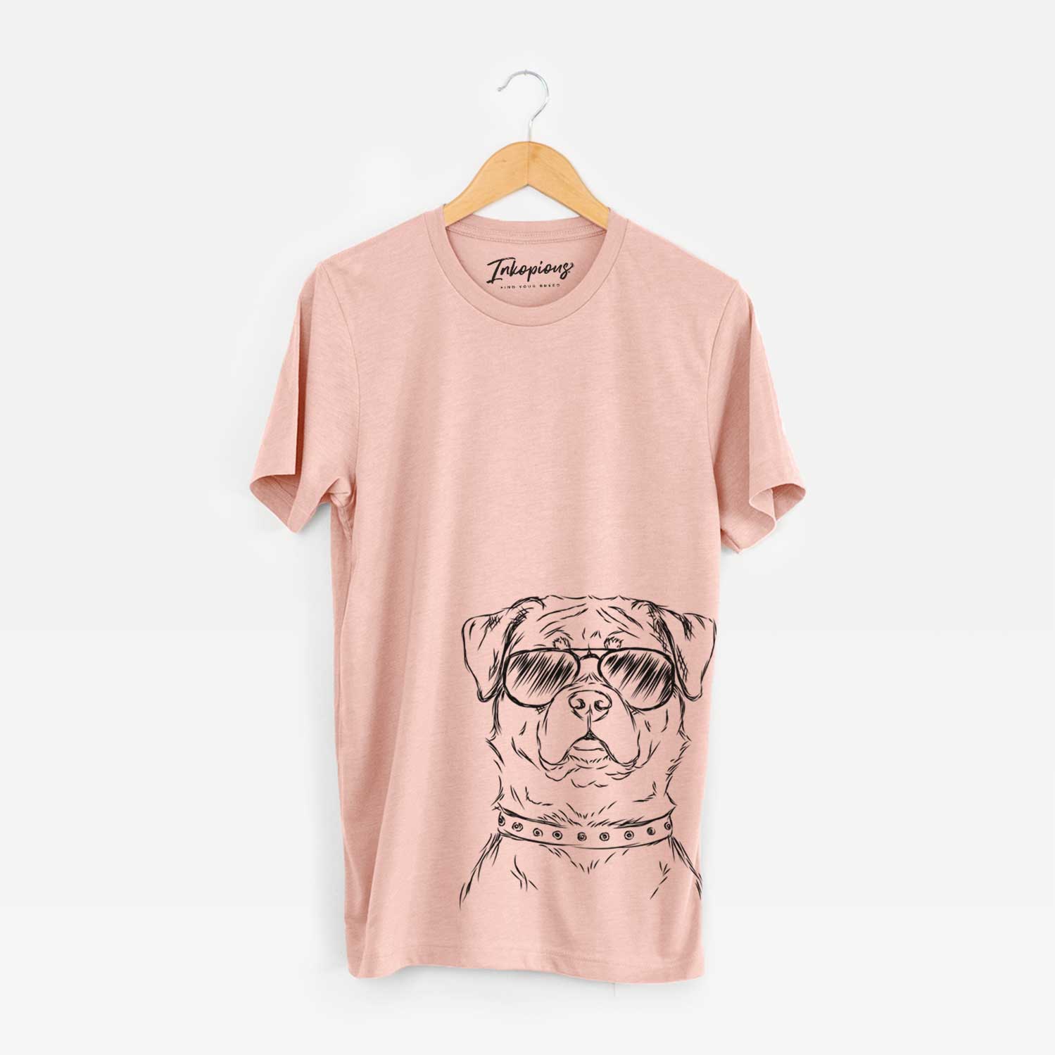 Hand-drawn sketch of Rocky the Rottweiler wearing aviator sunglasses on a Peach Bella Canvas Unisex Crewneck
