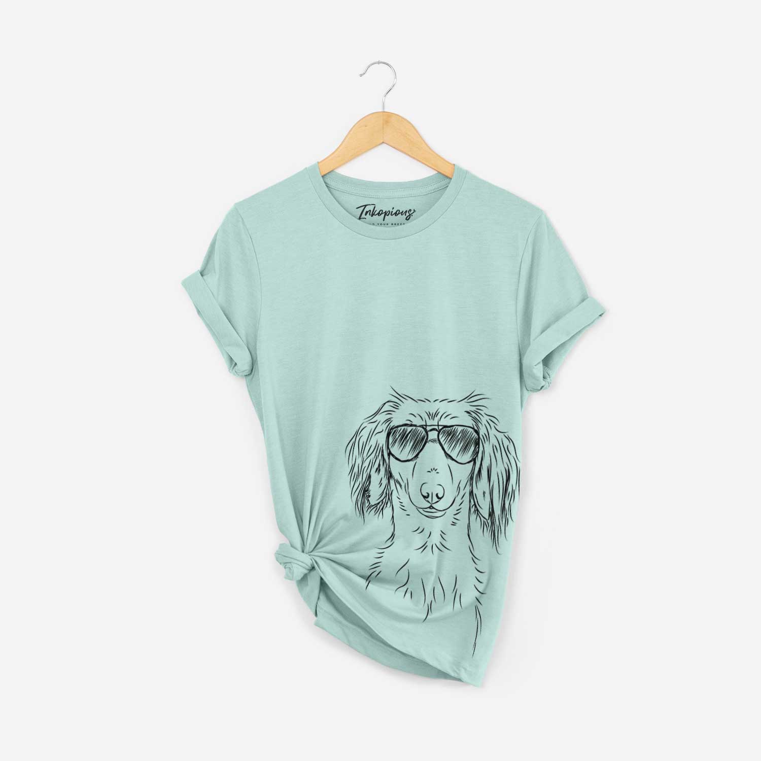 Hand-drawn sketch of Roux the Long Haired Dachshund wearing aviator sunglasses on a Heather Sage Bella Canvas Unisex Crewneck