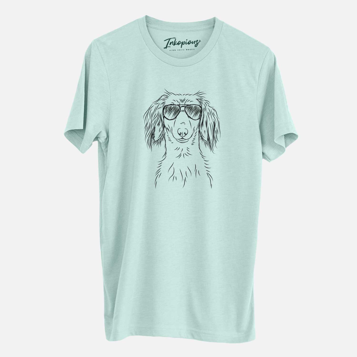Hand-drawn sketch of Roux the Long Haired Dachshund wearing aviator sunglasses on a Heather Sage Unisex crewneck