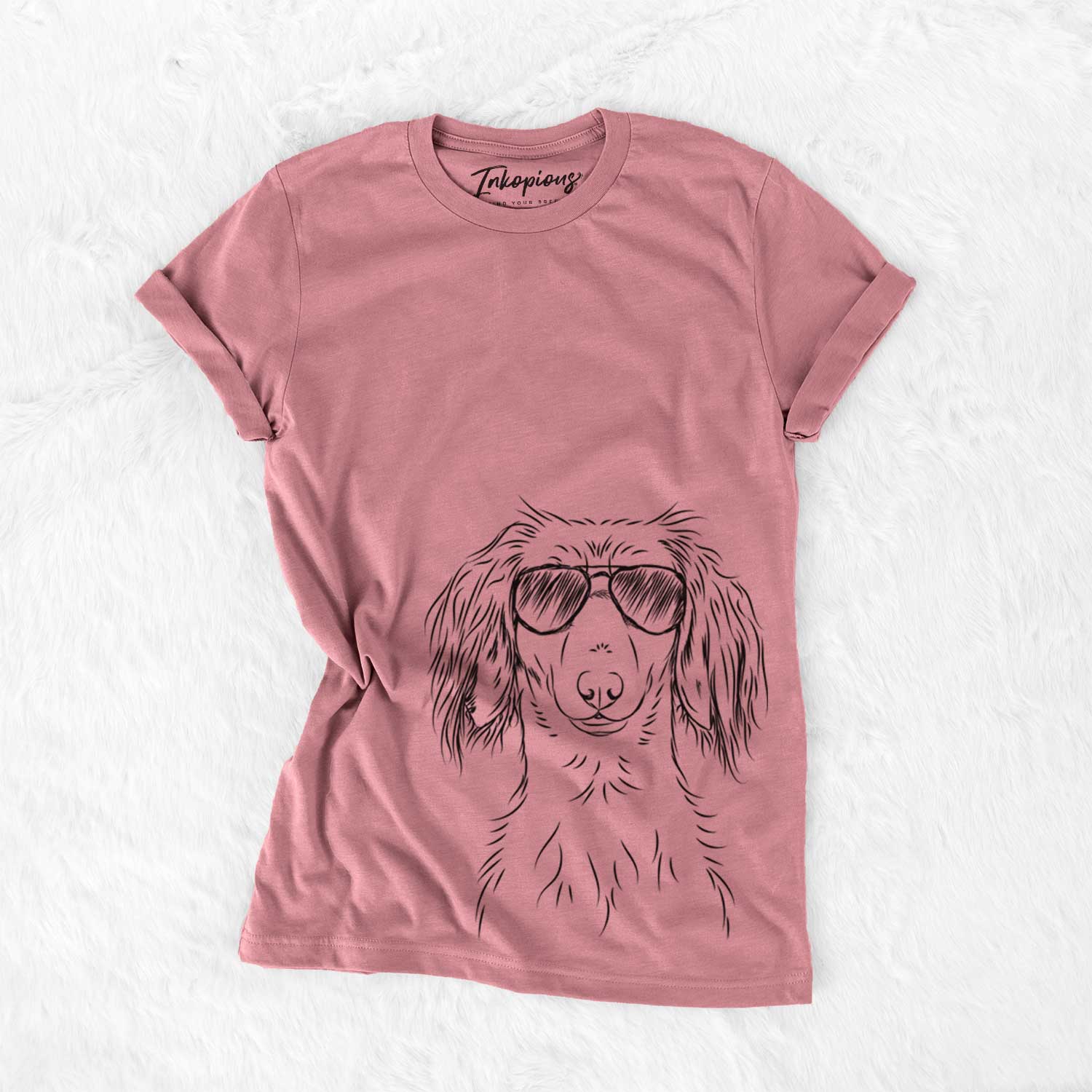 Hand-drawn sketch of Roux the Long Haired Dachshund wearing aviator sunglasses on a Mauve Unisex crewneck