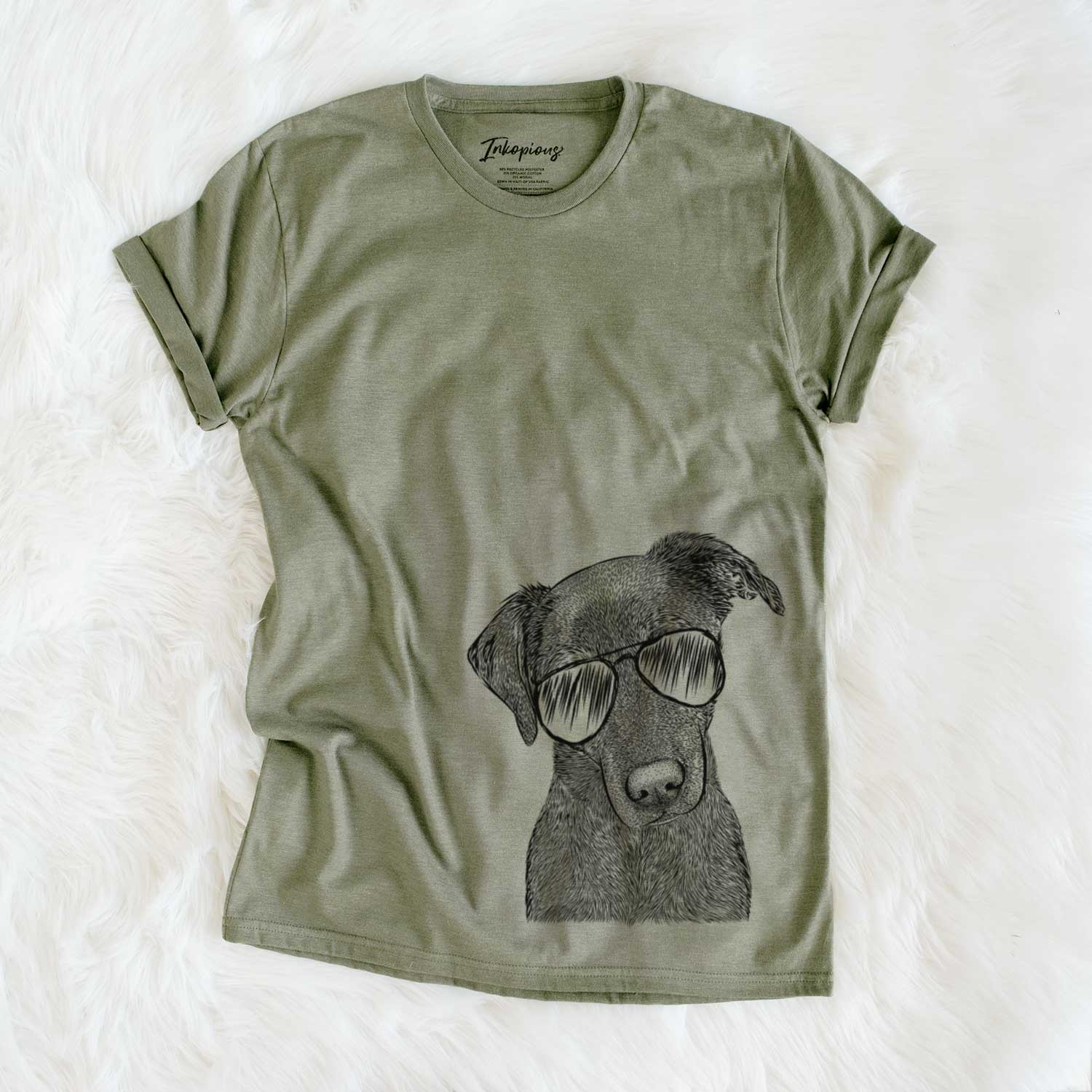 Hand-drawn sketch of Sadie the Whipador wearing aviator sunglasses on an Olive Unisex crewneck