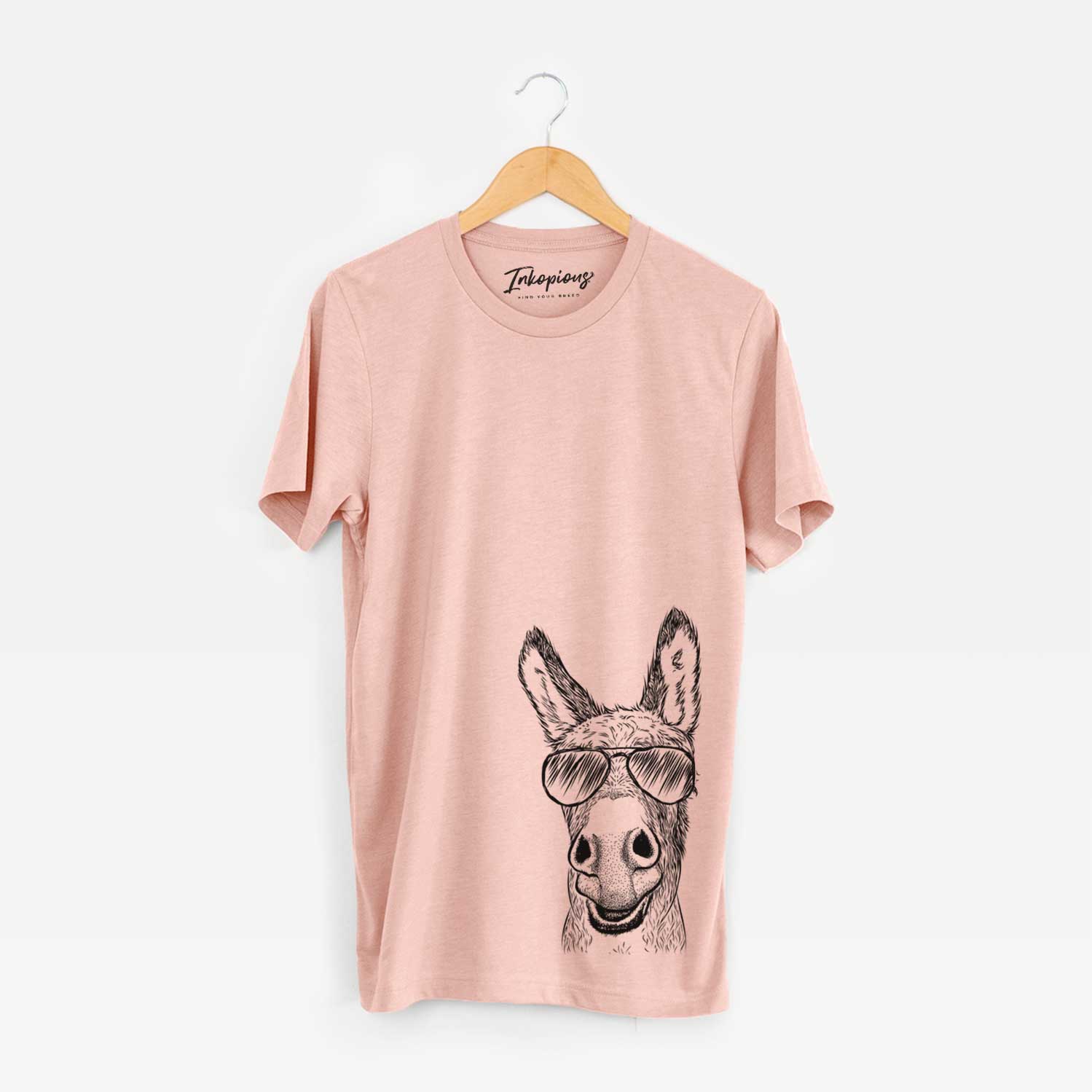 Hand-drawn sketch of Samule the Donkey wearing aviator sunglasses on a Peach Bella Canvas Unisex Crewneck