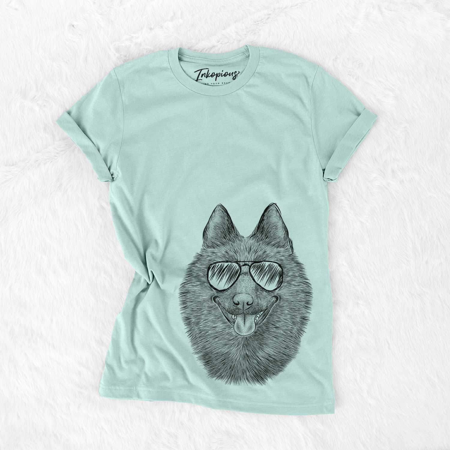 Hand-drawn sketch of Sander the Schipperke wearing aviator sunglasses on a Heather Sage Unisex crewneck