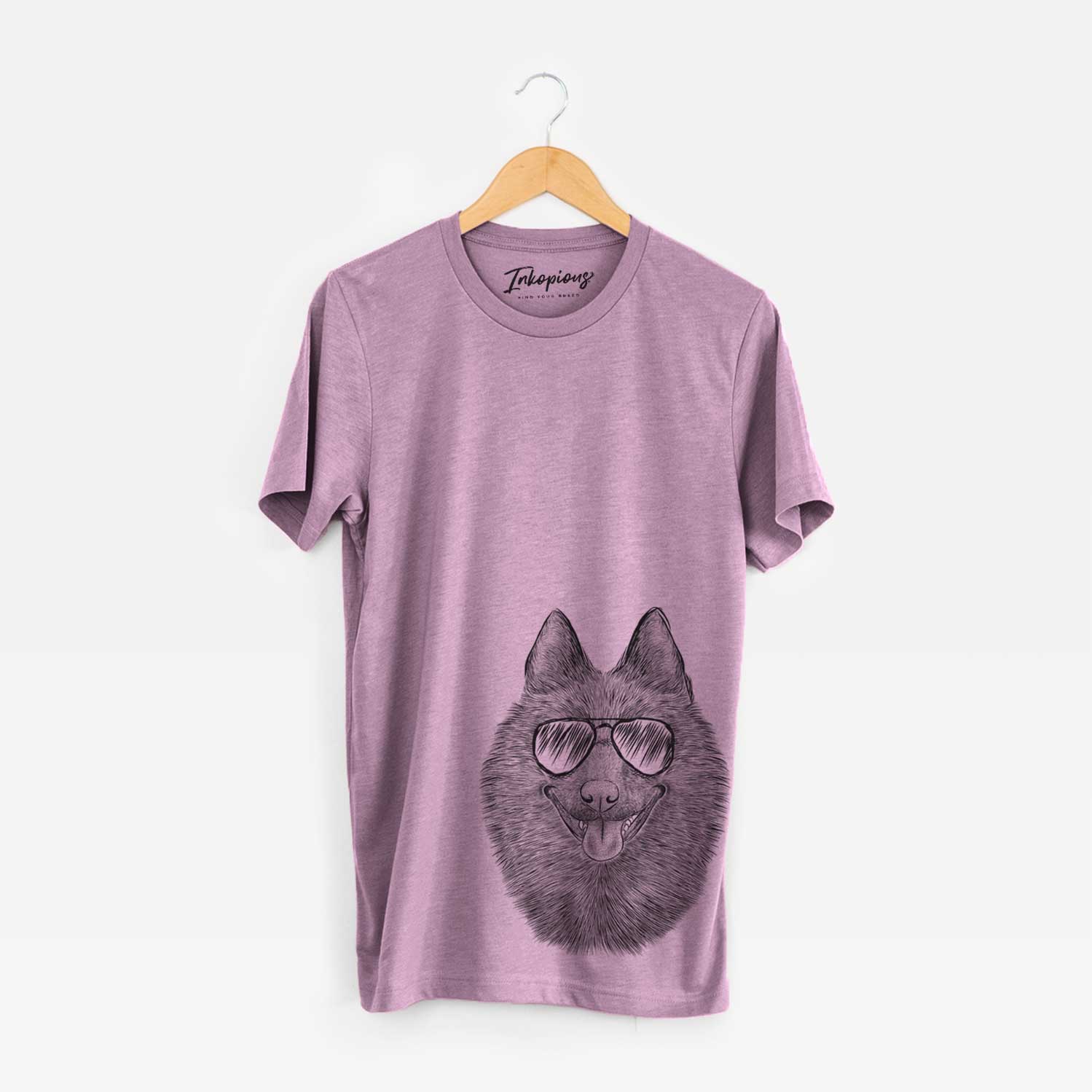 Hand-drawn sketch of Sander the Schipperke wearing aviator sunglasses on an Orchid Unisex crewneck