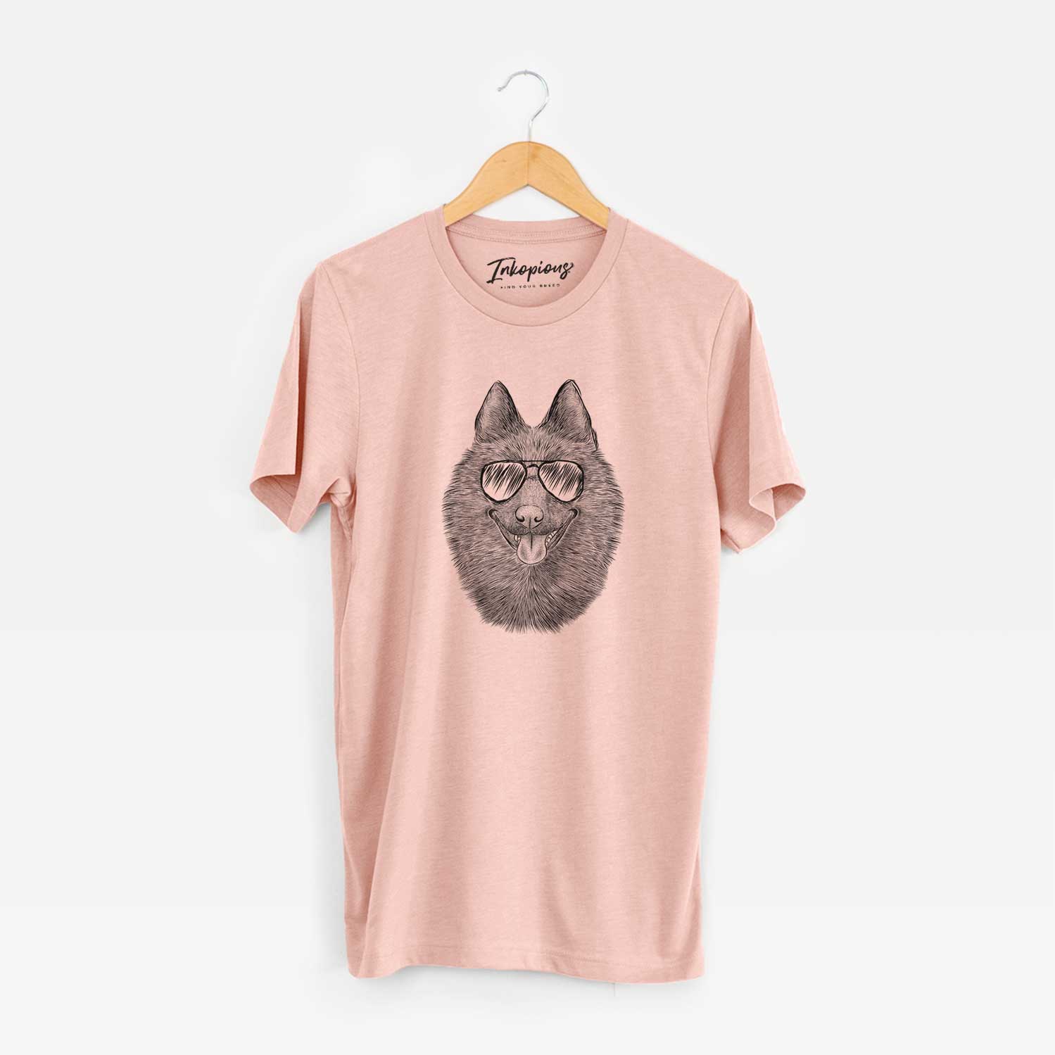 Hand-drawn sketch of Sander the Schipperke wearing aviator sunglasses on a Peach Unisex crewneck