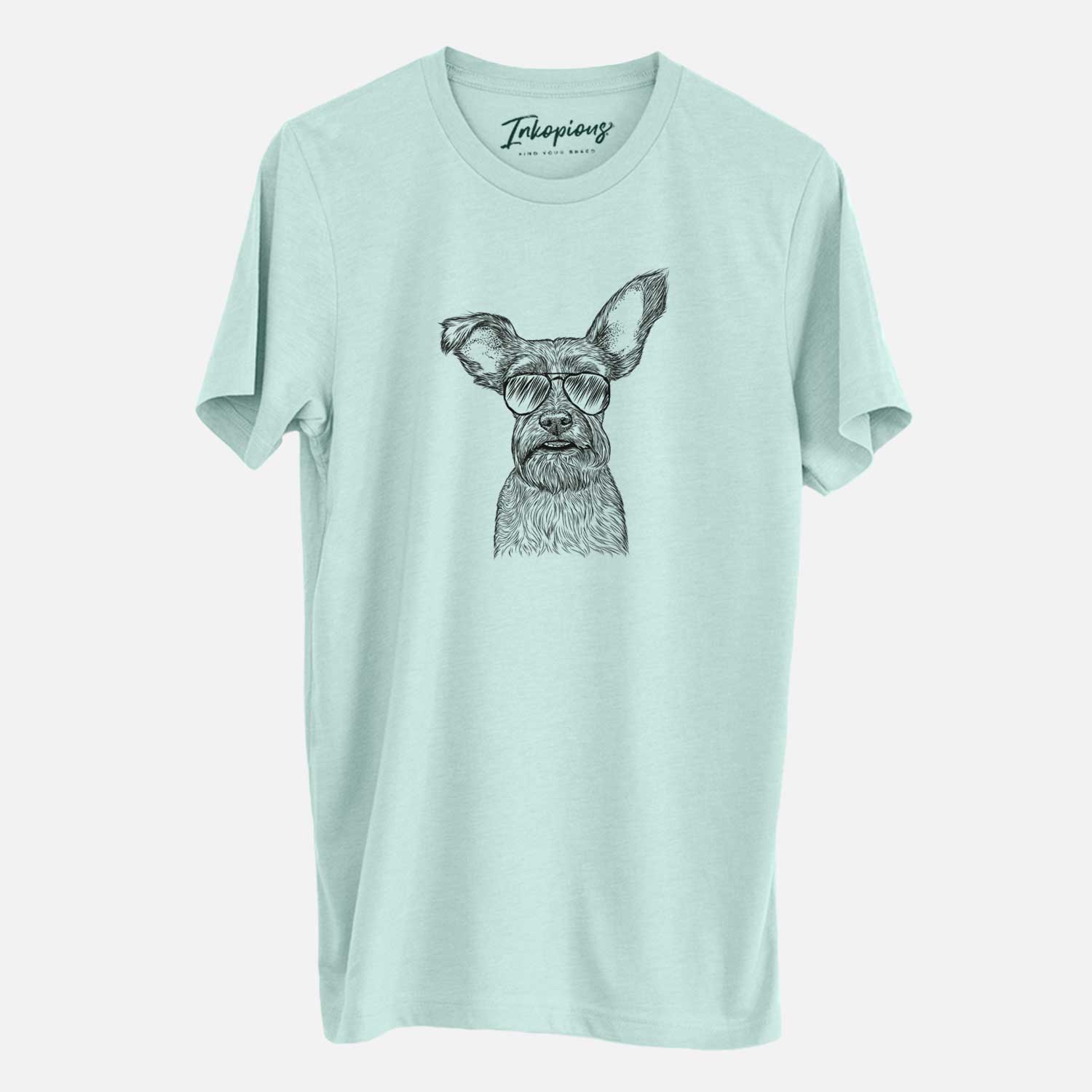 Hand-drawn sketch of Sawyer the Snorkie wearing aviator sunglasses on a Heather Sage Unisex crewneck