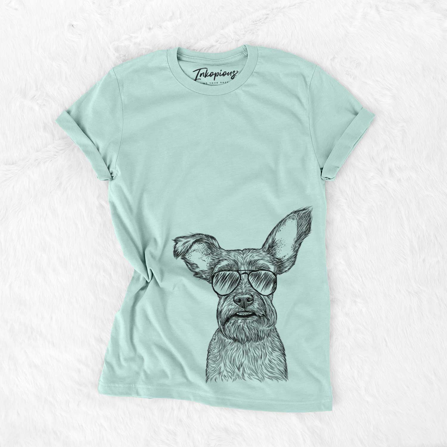 Hand-drawn sketch of Sawyer the Snorkie wearing aviator sunglasses on a Heather Sage Unisex crewneck