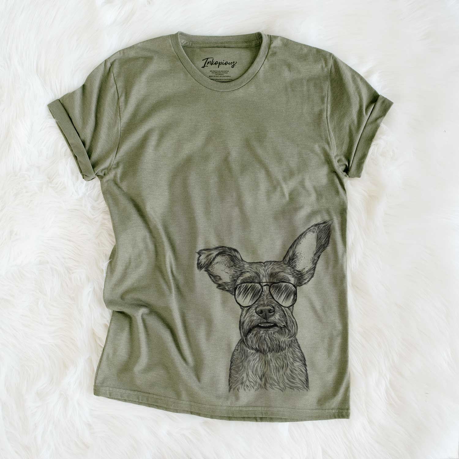 Hand-drawn sketch of Sawyer the Snorkie wearing aviator sunglasses on an Olive Unisex crewneck