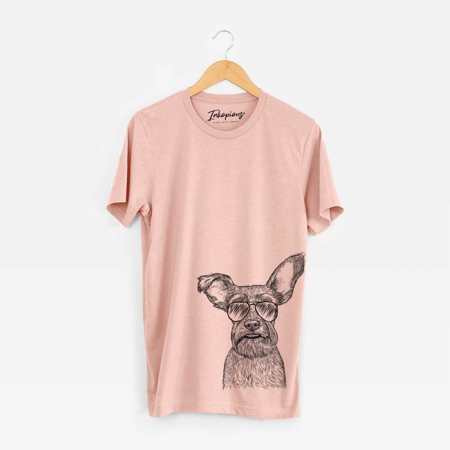 Hand-drawn sketch of Sawyer the Snorkie wearing aviator sunglasses on a Peach Unisex crewneck