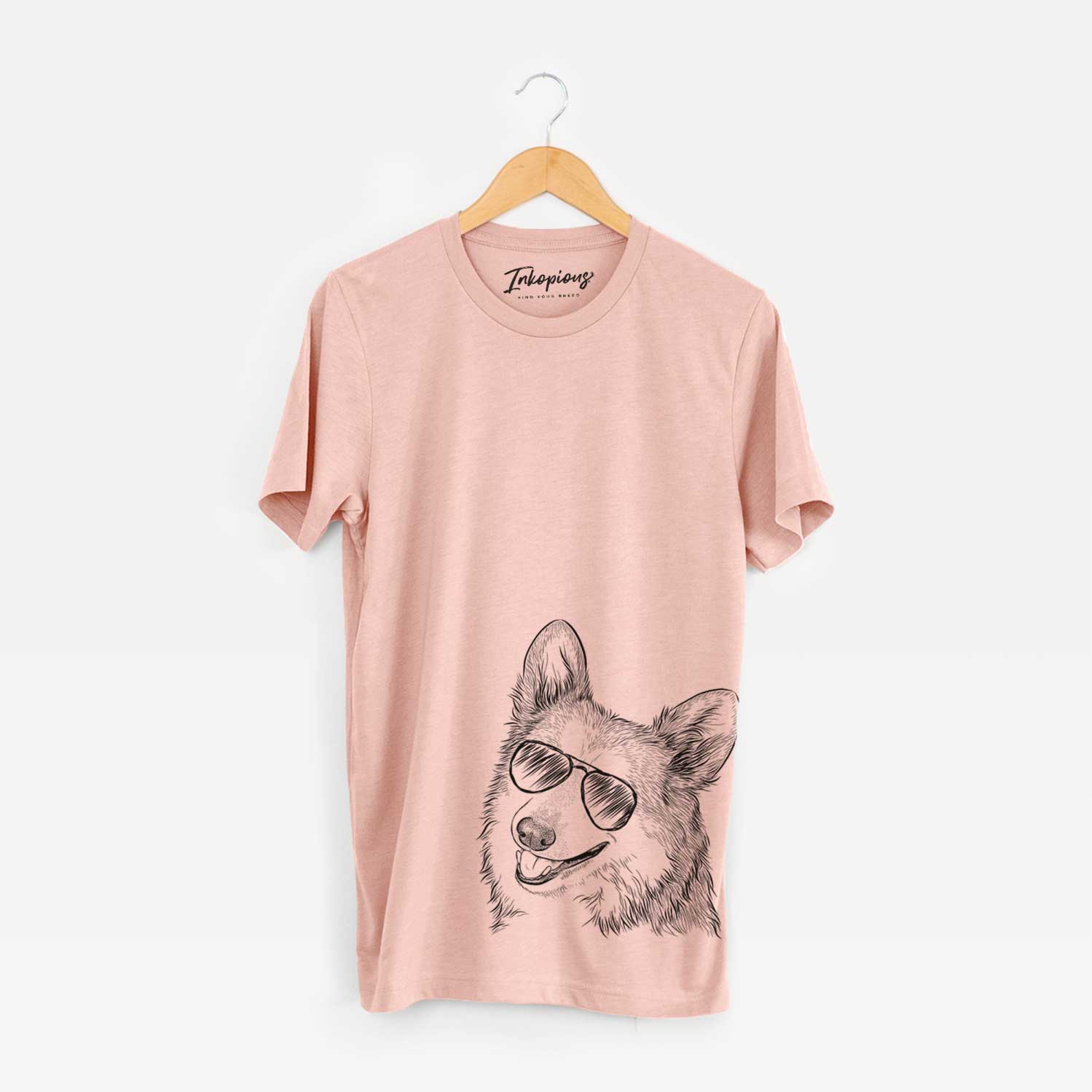 Hand-drawn sketch of Scout the Pembroke Welsh Corgi wearing aviator sunglasses on a Peach Bella Canvas Unisex Crewneck