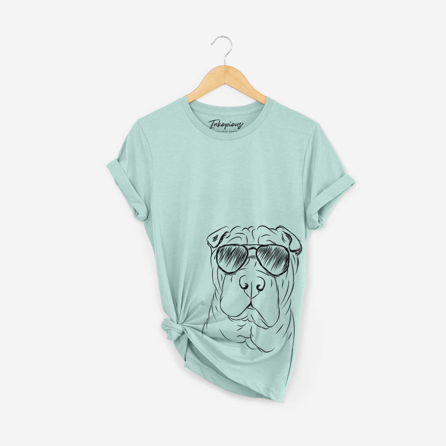 Hand-drawn sketch of Sharpy the Shar Pei wearing aviator sunglasses on a Heather Sage Bella Canvas Unisex Crewneck
