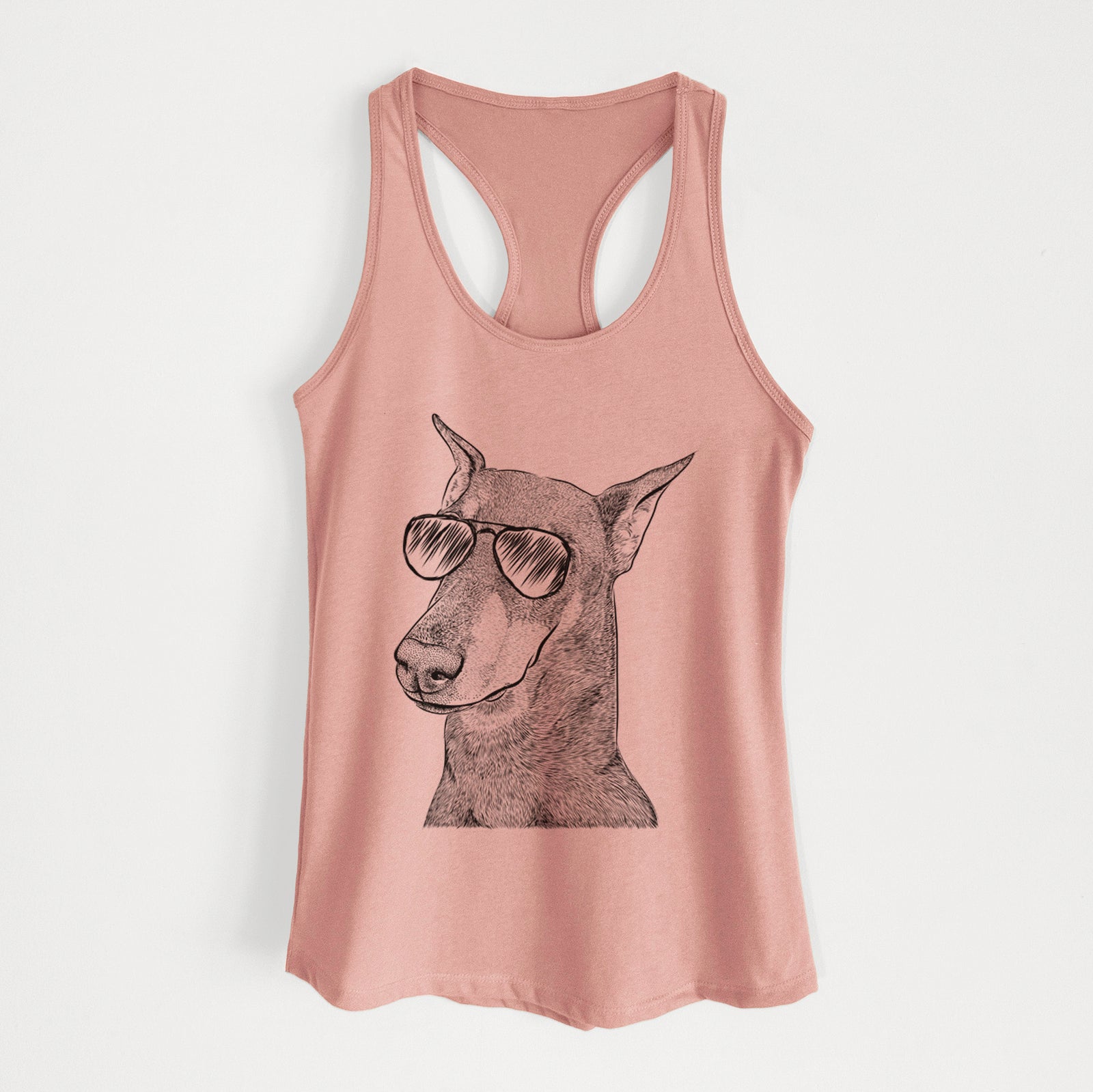 Hand-drawn sketch of Shelby the Doberman Pinscher wearing aviator sunglasses on a Desert Pink Women's racerback tanktop