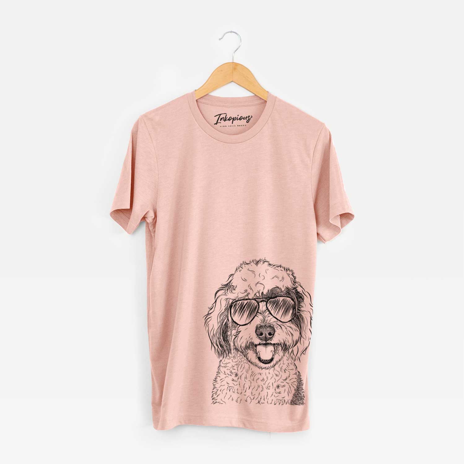 Hand-drawn sketch of Sherlock the Sheepadoodle wearing aviator sunglasses on a Peach Bella Canvas Unisex Crewneck