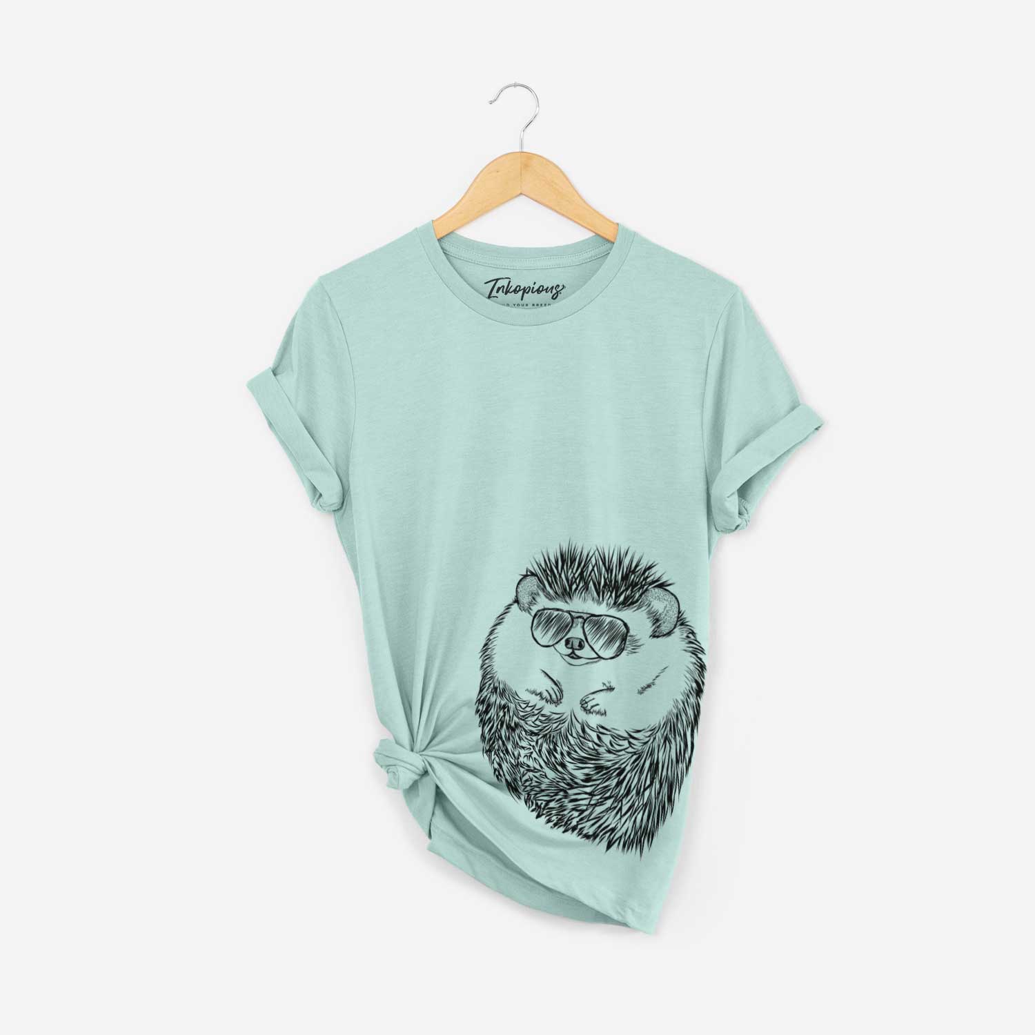 Hand-drawn sketch of Sid the Hedgehog wearing aviator sunglasses on a Heather Sage Bella Canvas Unisex Crewneck