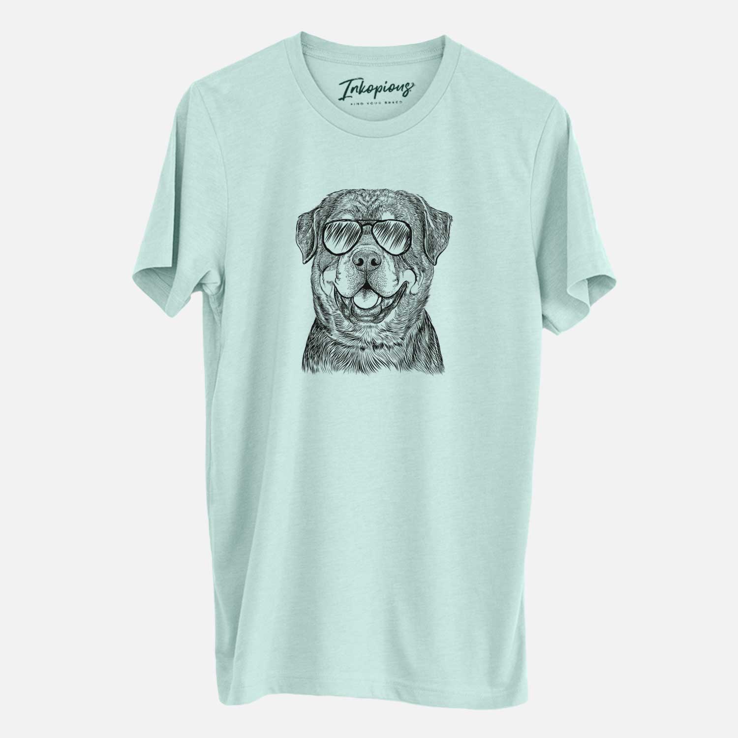 Hand-drawn sketch of Sig the Rottweiler wearing aviator sunglasses on a Heather Sage Unisex crewneck