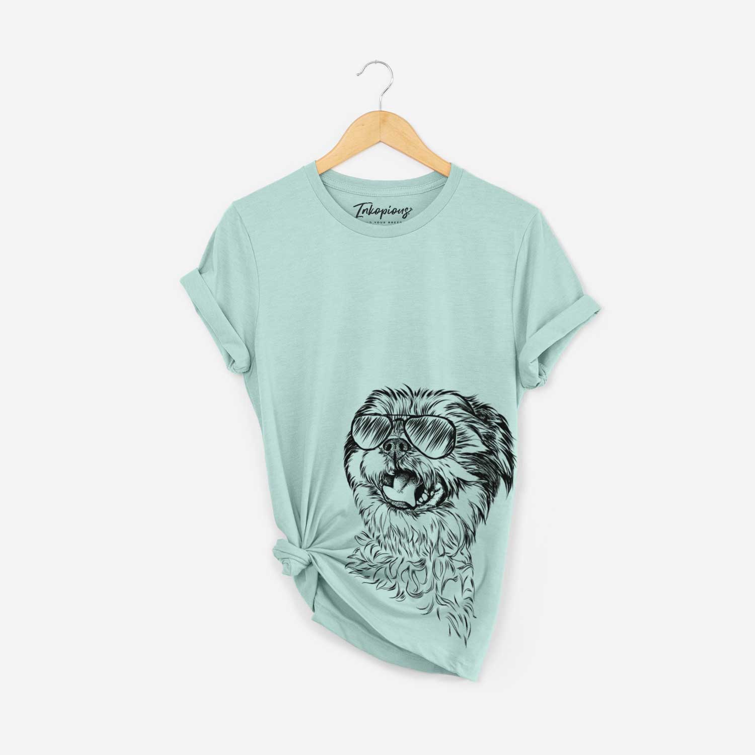 Hand-drawn sketch of Sugar the Malshi wearing aviator sunglasses on a Heather Sage Bella Canvas Unisex Crewneck
