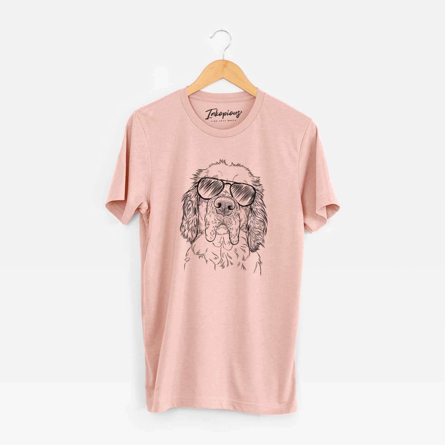 Hand-drawn sketch of Sully the Clumber Spaniel wearing aviator sunglasses on a Peach Unisex crewneck
