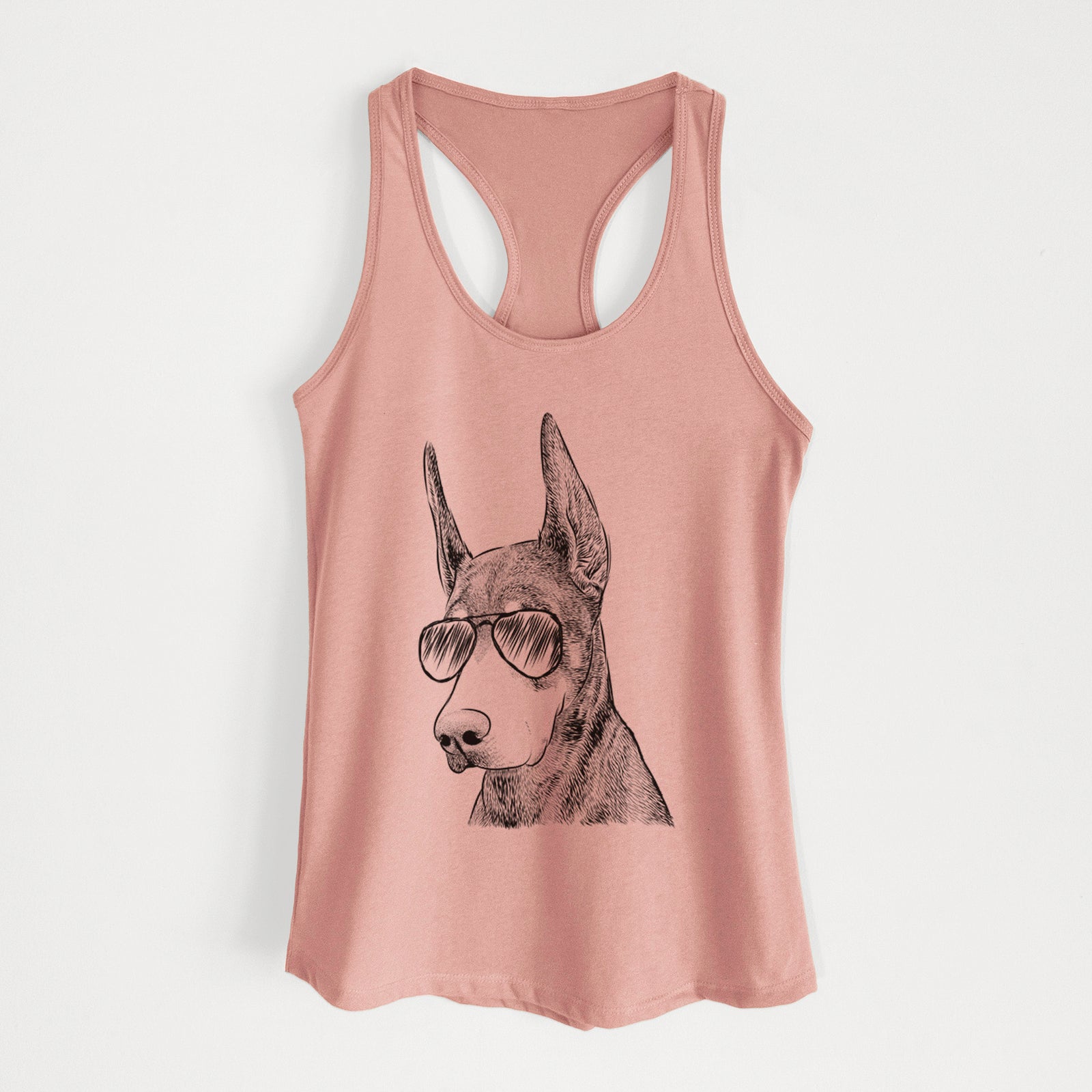 Hand-drawn sketch of Sunny the Doberman Pinscher wearing aviator sunglasses on a Desert Pink Women's racerback tanktop