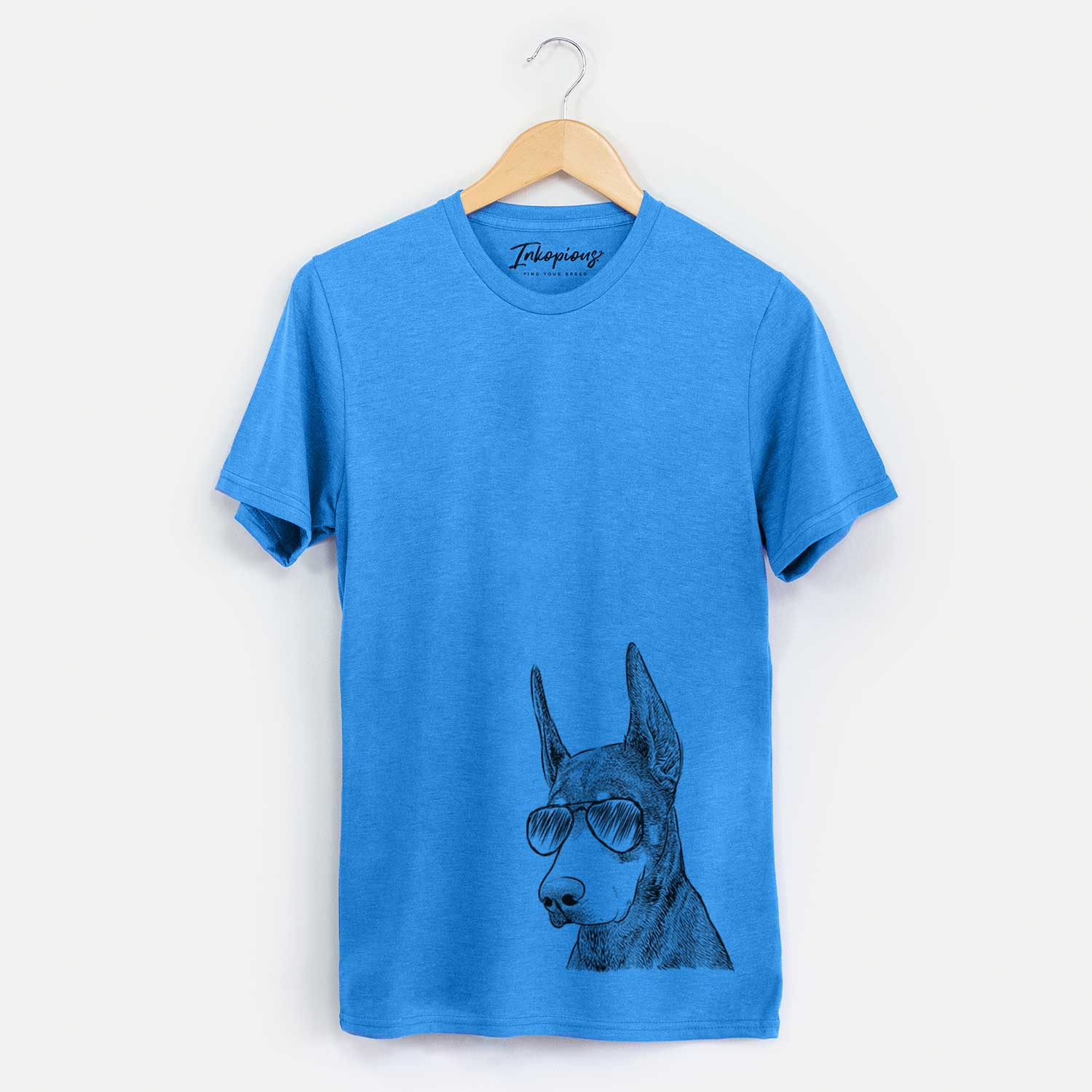 Hand-drawn sketch of Sunny the Doberman Pinscher wearing aviator sunglasses on a Blue Unisex crewneck
