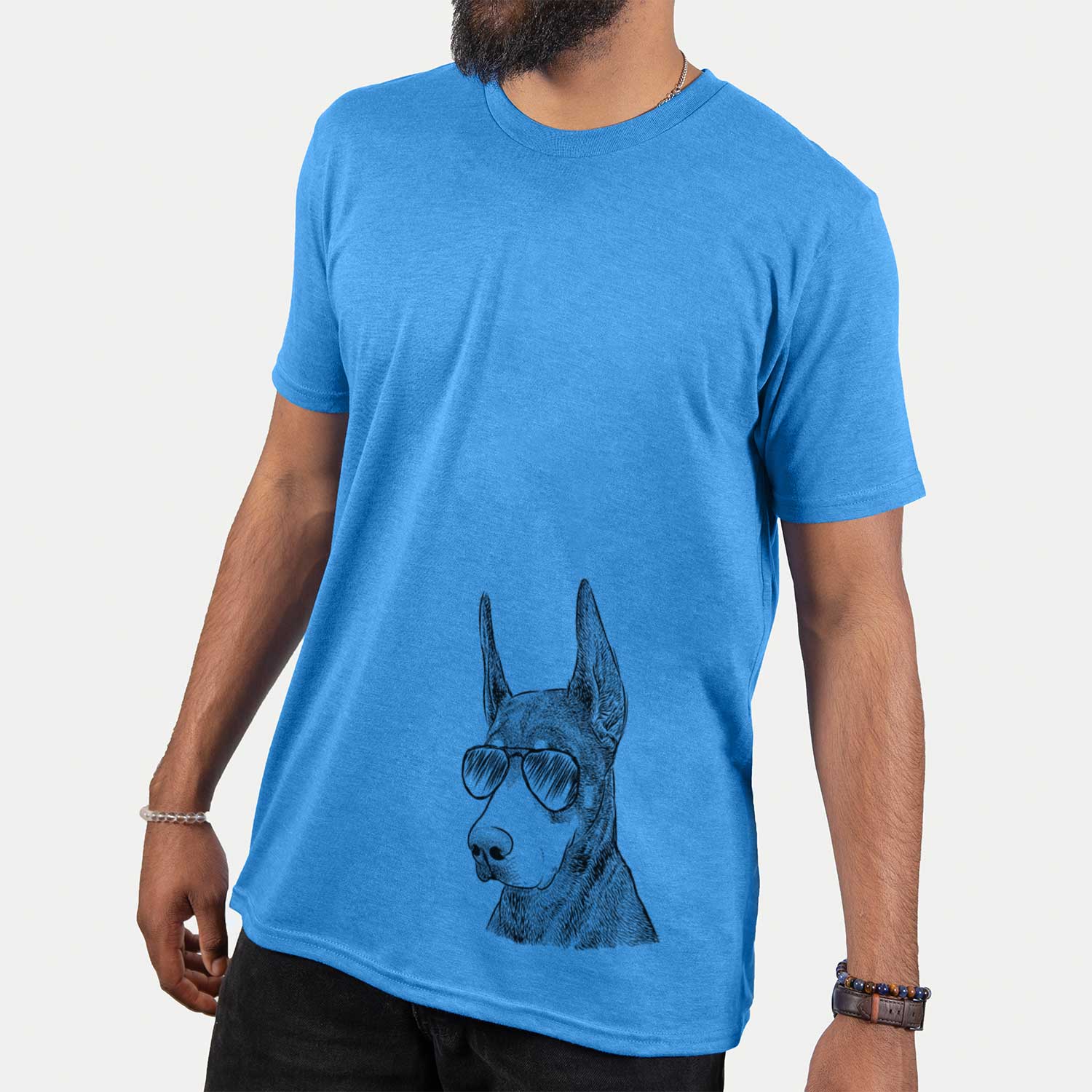 Hand-drawn sketch of Sunny the Doberman Pinscher wearing aviator sunglasses on a Blue Unisex crewneck