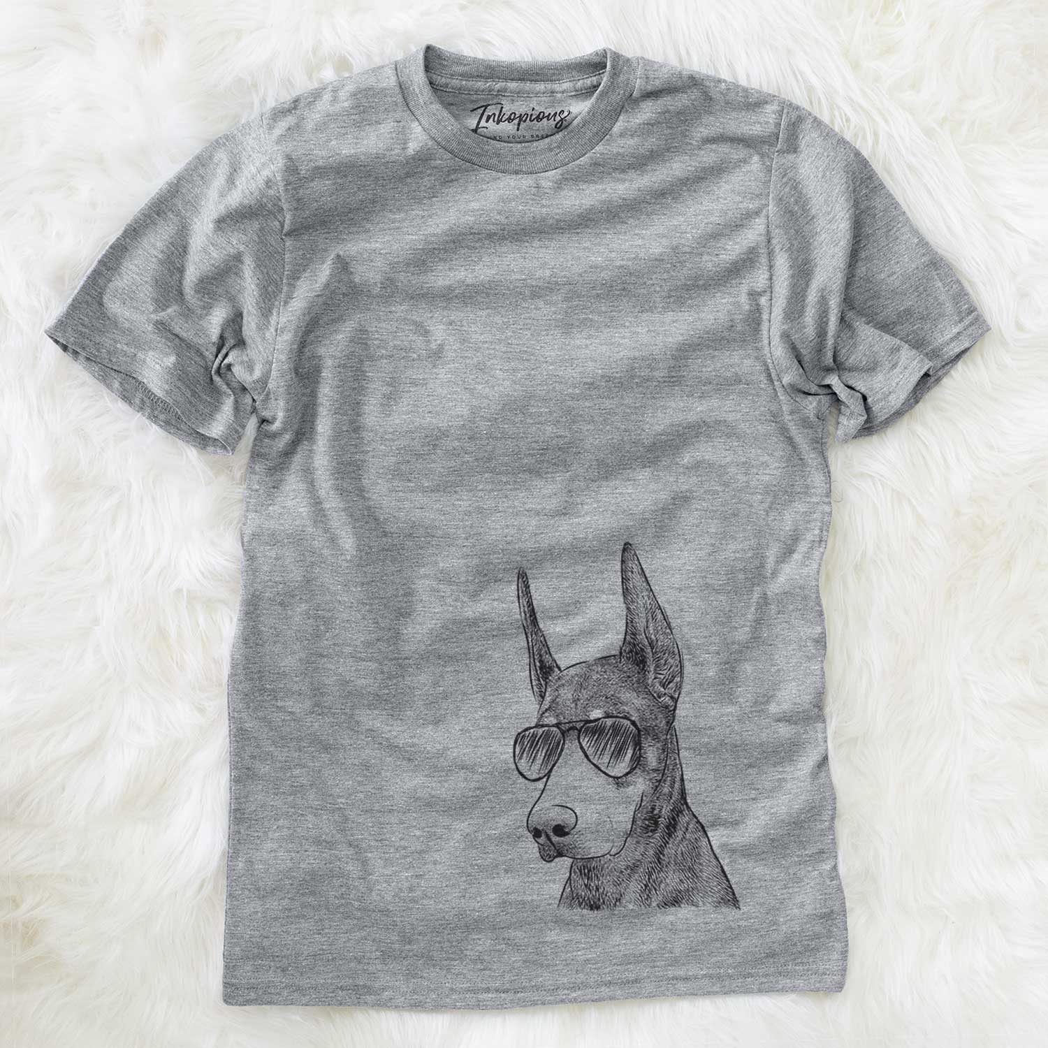 Hand-drawn sketch of Sunny the Doberman Pinscher wearing aviator sunglasses on a Grey Unisex crewneck