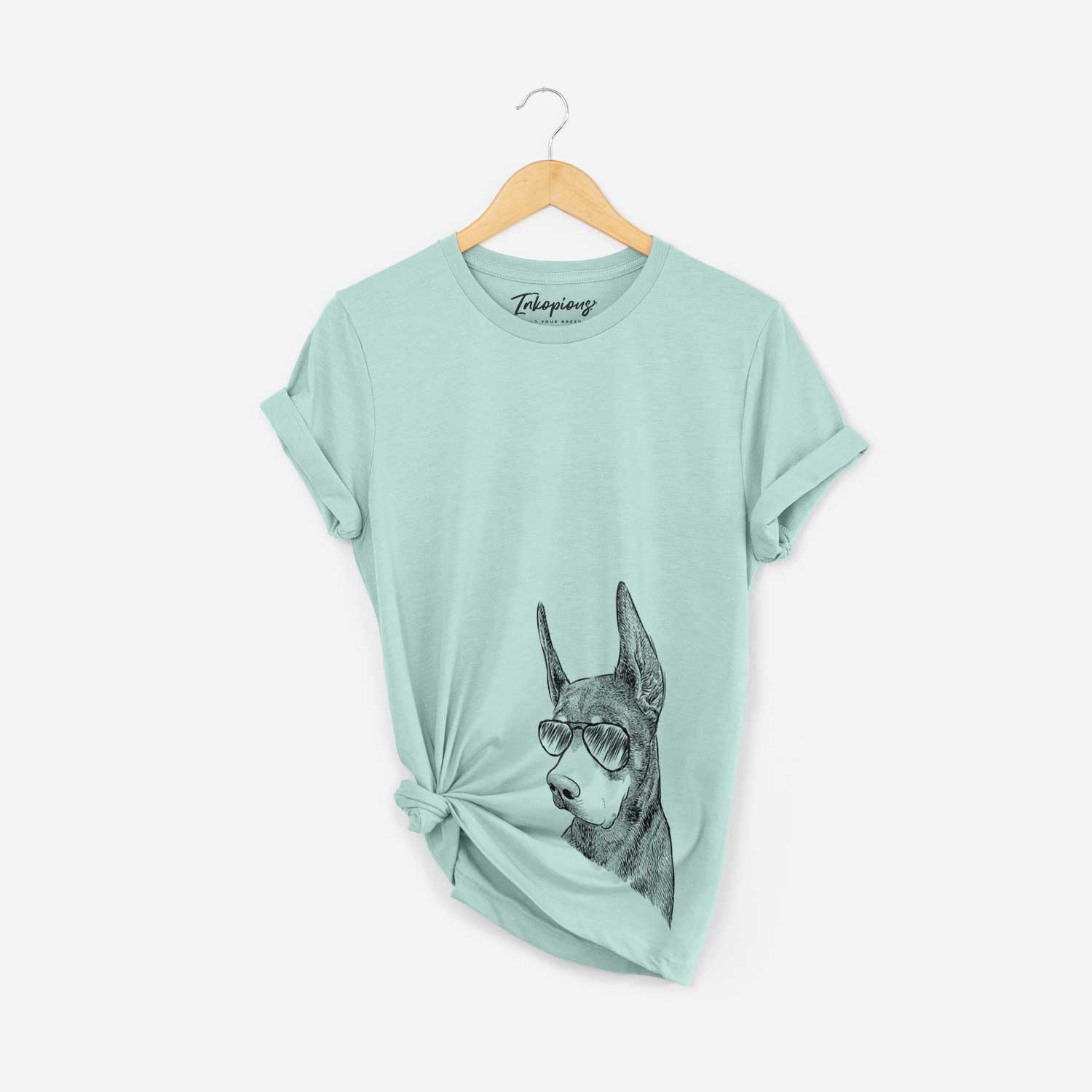 Hand-drawn sketch of Sunny the Doberman Pinscher wearing aviator sunglasses on a Heather Sage Bella Canvas Unisex Crewneck