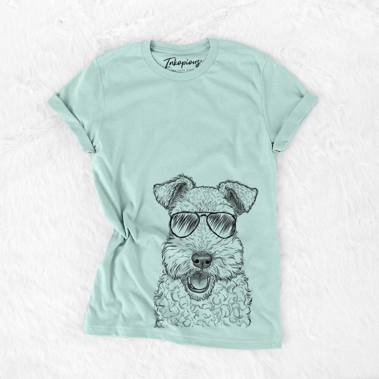 Hand-drawn sketch of Ted the Wire Fox Terrier wearing aviator sunglasses on a Heather Sage Unisex crewneck
