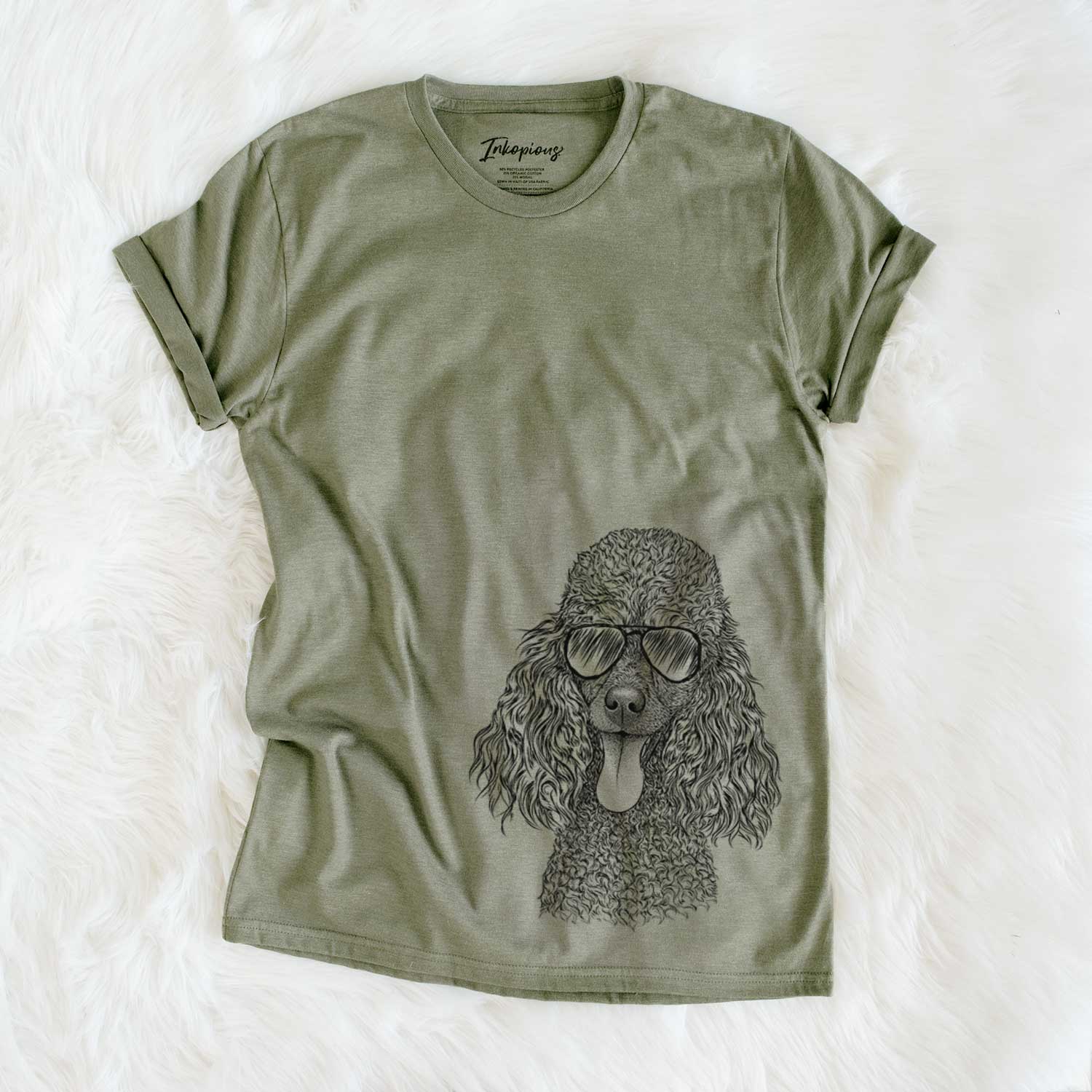 Hand-drawn sketch of Teddy the Mini Poodle wearing aviator sunglasses on an Olive Unisex crewneck