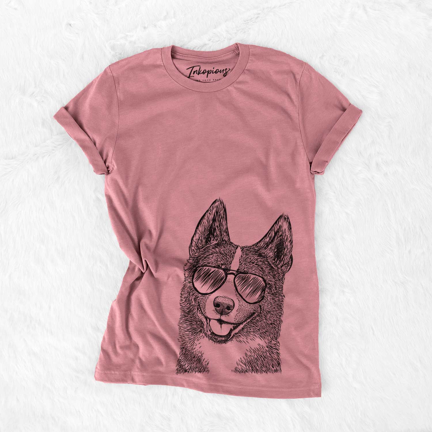 Hand-drawn sketch of Tosca the Karelian Bear Dog wearing aviator sunglasses on a Mauve Bella Canvas Unisex Crewneck