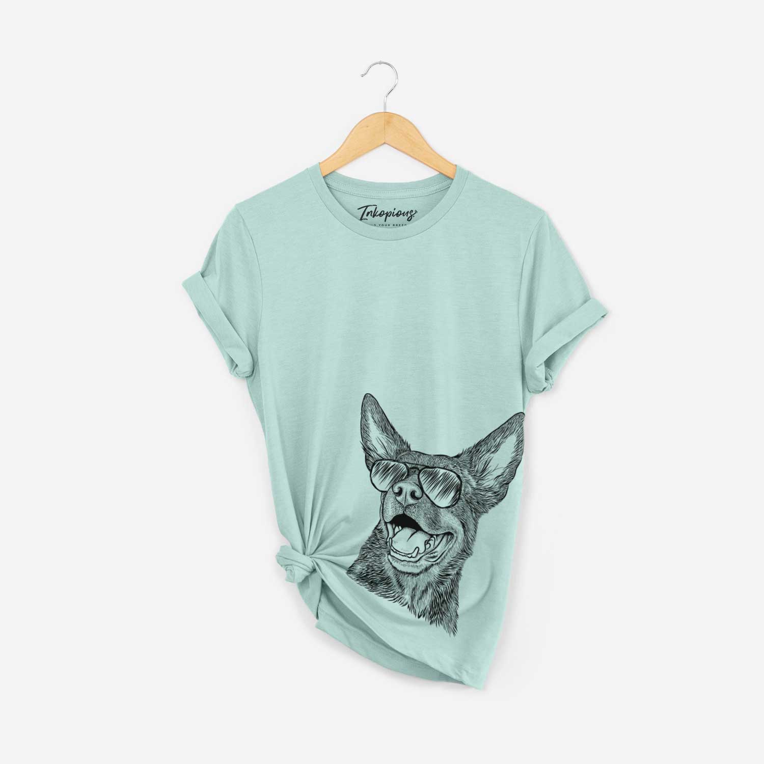 Hand-drawn sketch of Tucker the Australian Kelpie wearing aviator sunglasses on a Heather Sage Bella Canvas Unisex Crewneck