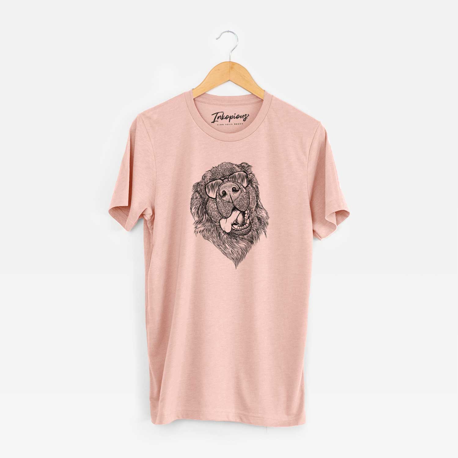 Hand-drawn sketch of Tuna the Newfoundland wearing aviator sunglasses on a Peach Unisex crewneck