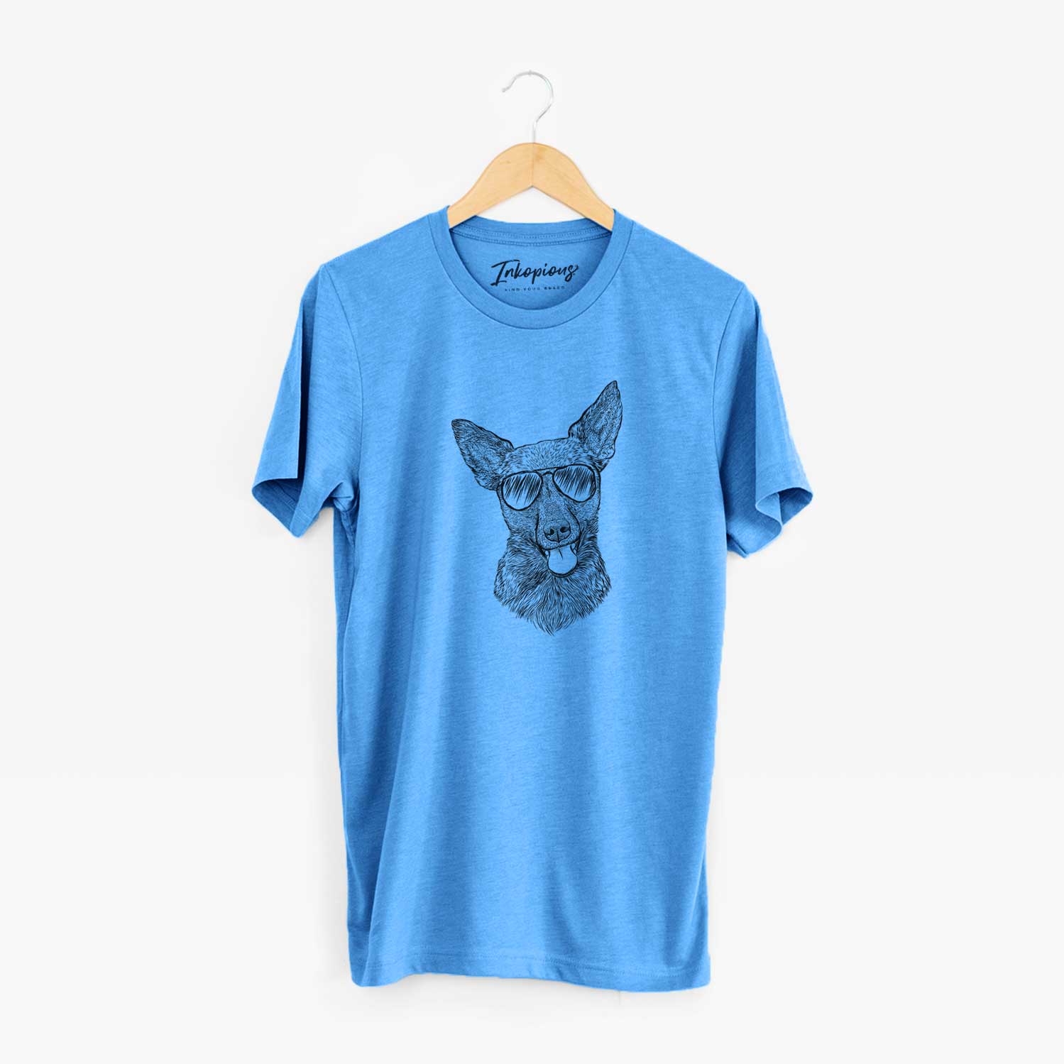 Hand-drawn sketch of Ursa the Mixed Breed wearing aviator sunglasses on a Blue Unisex crewneck