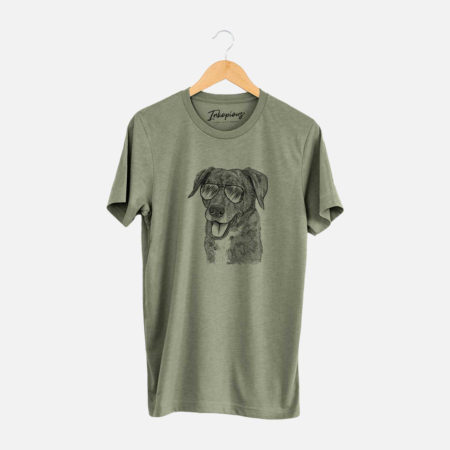 Hand-drawn sketch of Wally the Mixed Breed wearing aviator sunglasses on an Olive Unisex crewneck