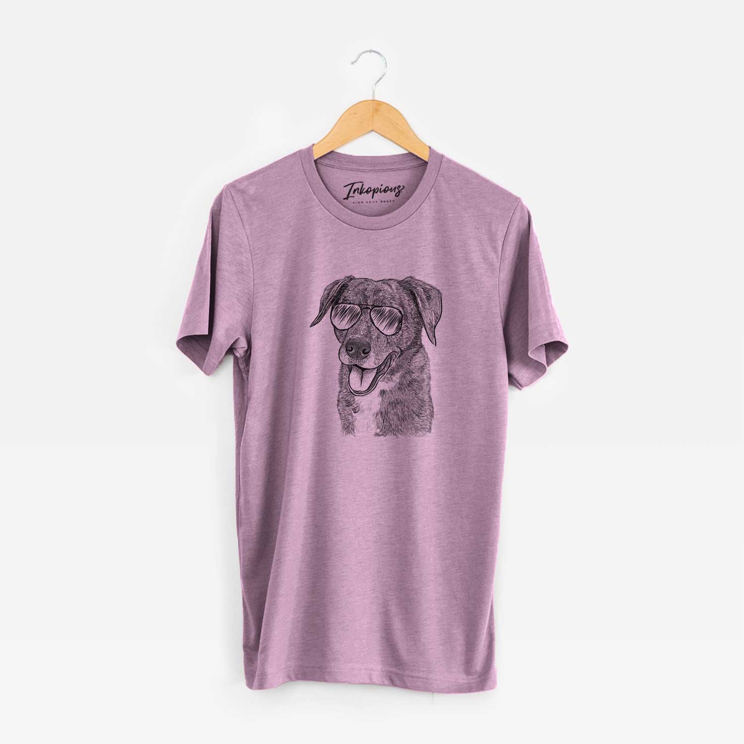 Hand-drawn sketch of Wally the Mixed Breed wearing aviator sunglasses on an Orchid Unisex crewneck