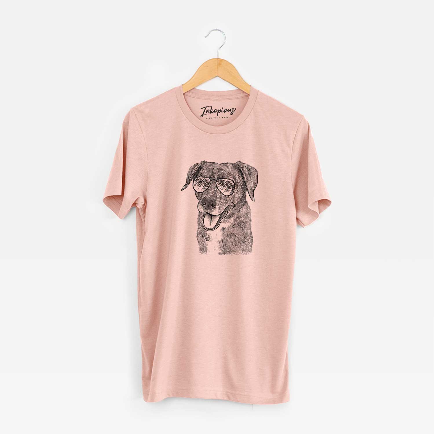 Hand-drawn sketch of Wally the Mixed Breed wearing aviator sunglasses on a Peach Unisex crewneck