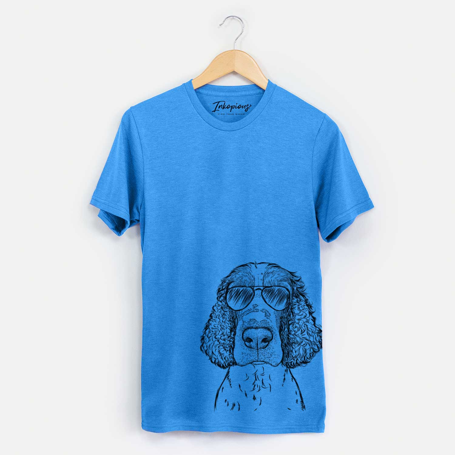 Hand-drawn sketch of Wilbur the English Springer Spaniel wearing aviator sunglasses on a Blue Unisex crewneck