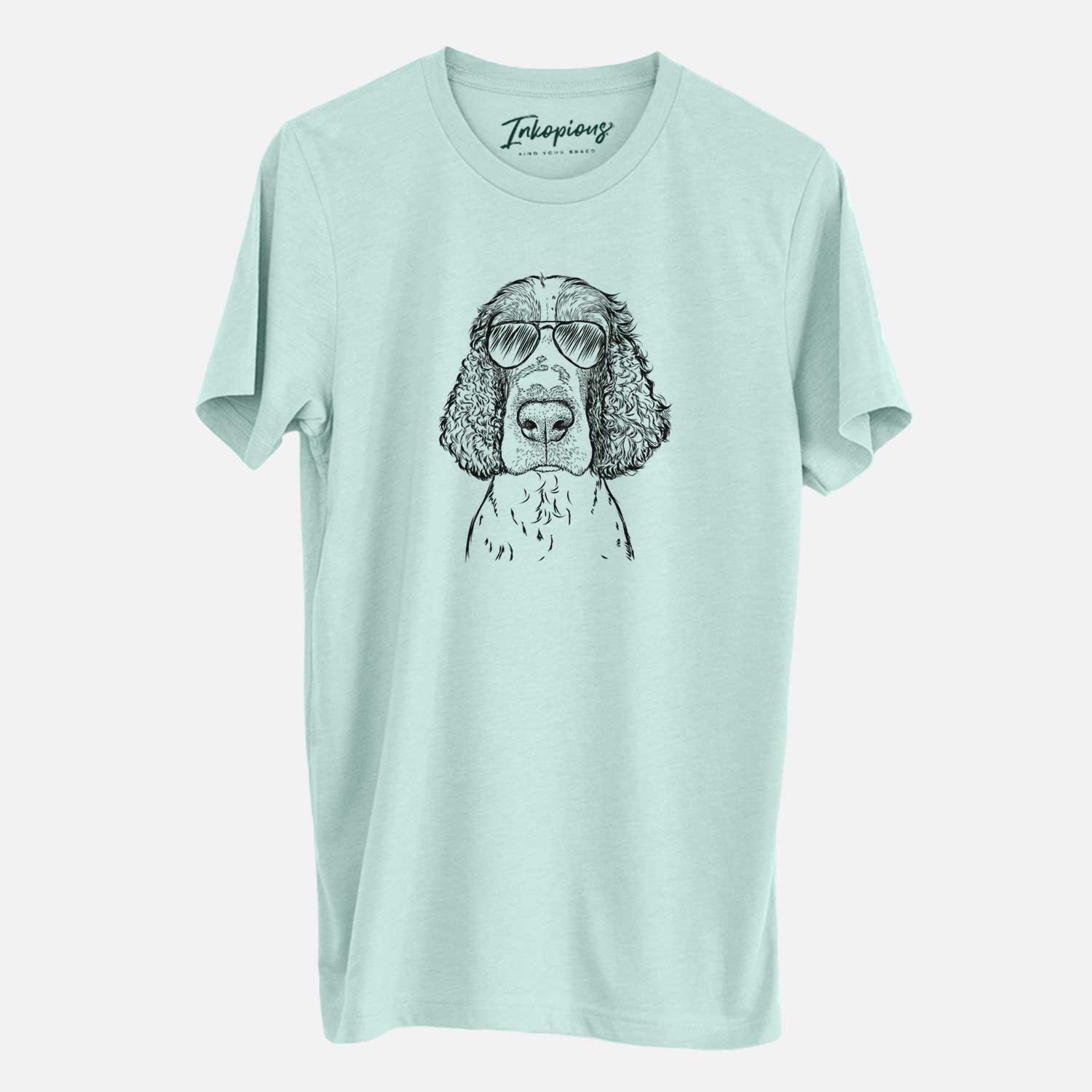 Hand-drawn sketch of Wilbur the English Springer Spaniel wearing aviator sunglasses on a Heather Sage Unisex crewneck