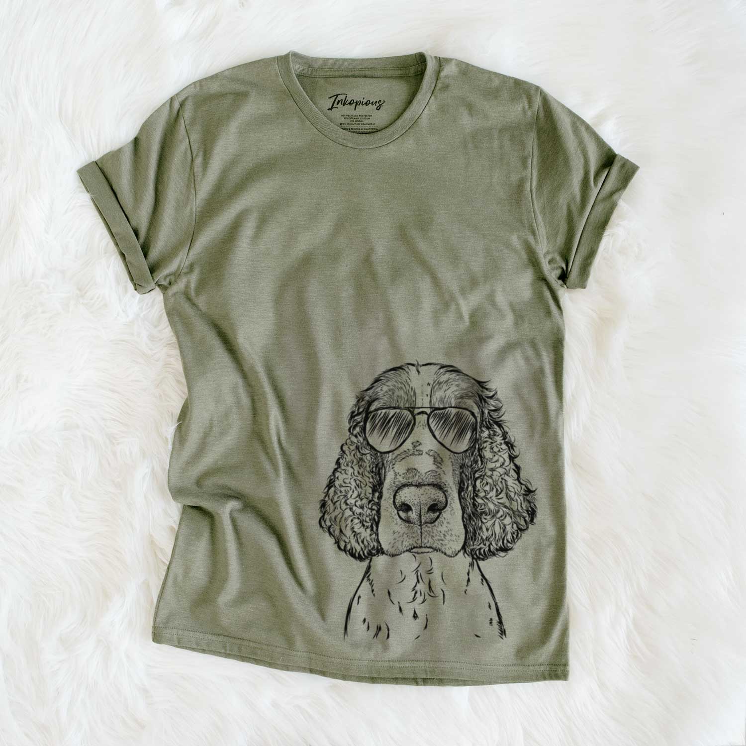 Hand-drawn sketch of Wilbur the English Springer Spaniel wearing aviator sunglasses on an Olive Unisex crewneck