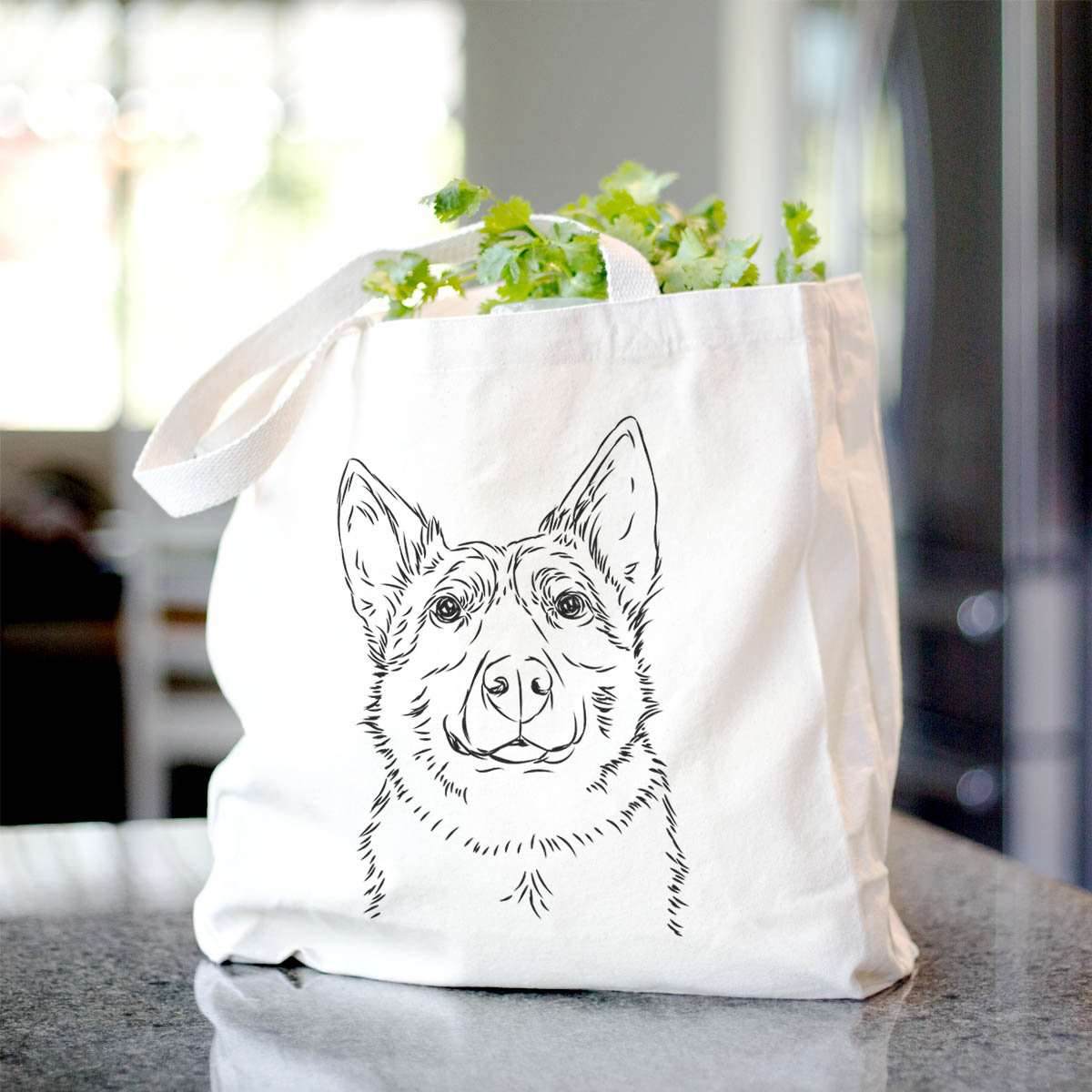 Hand-drawn sketch of Austin the Heeler on a tote