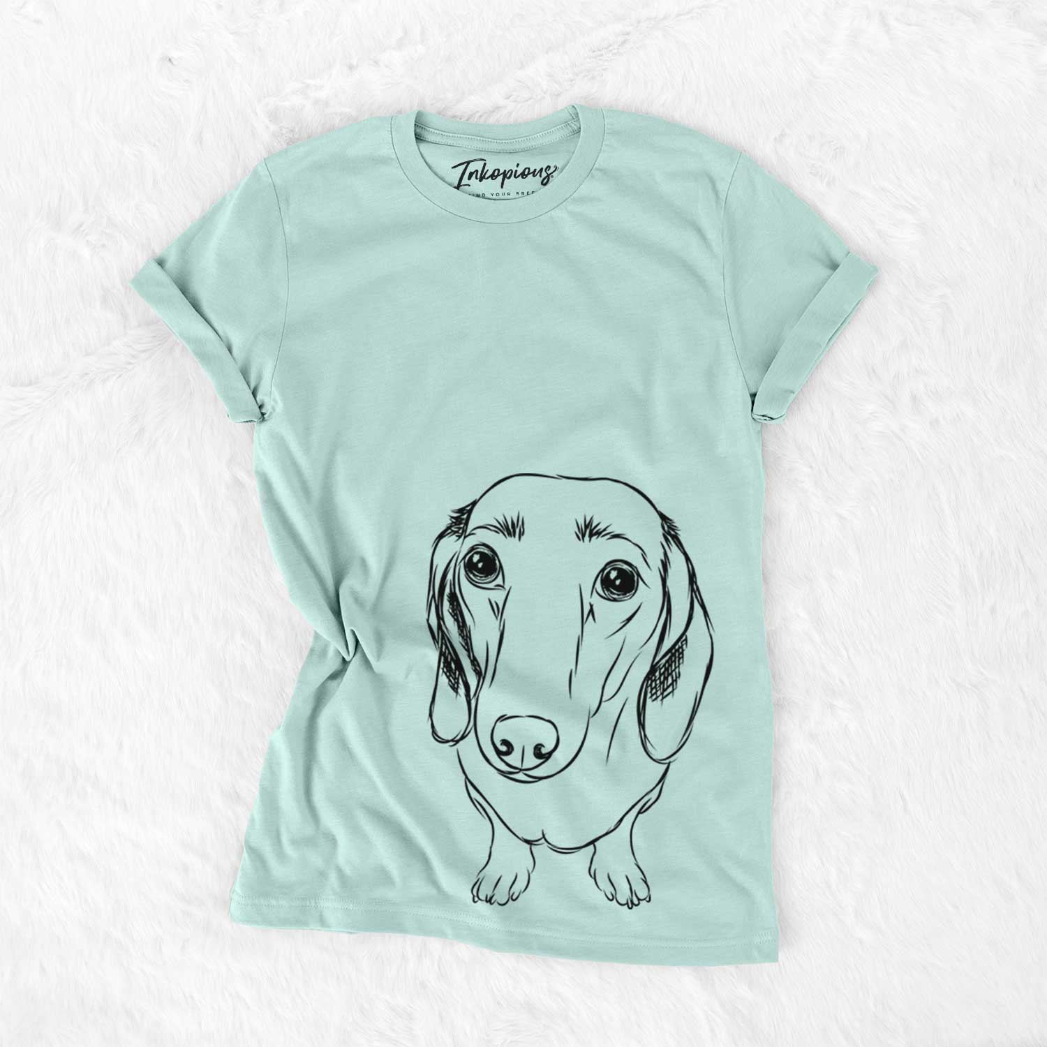 Hand-drawn sketch of Annabelle the Dachshund on a Heather Sage Unisex crewneck