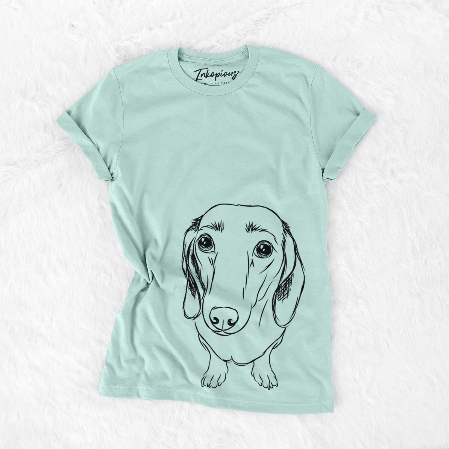 Hand-drawn sketch of Annabelle the Dachshund on a Heather Sage Bella Canvas Unisex Crewneck