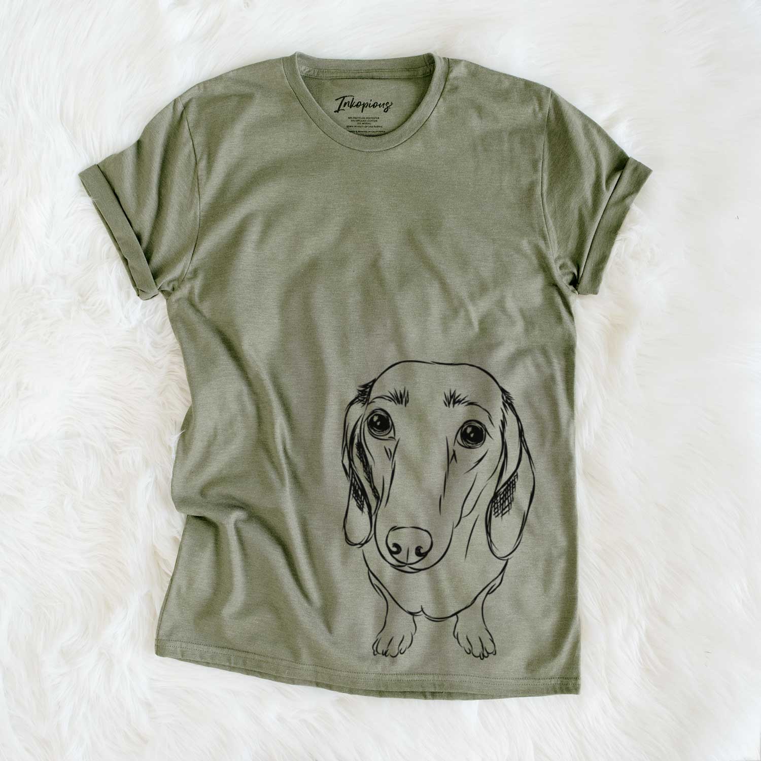 Hand-drawn sketch of Annabelle the Dachshund on an Olive Unisex crewneck