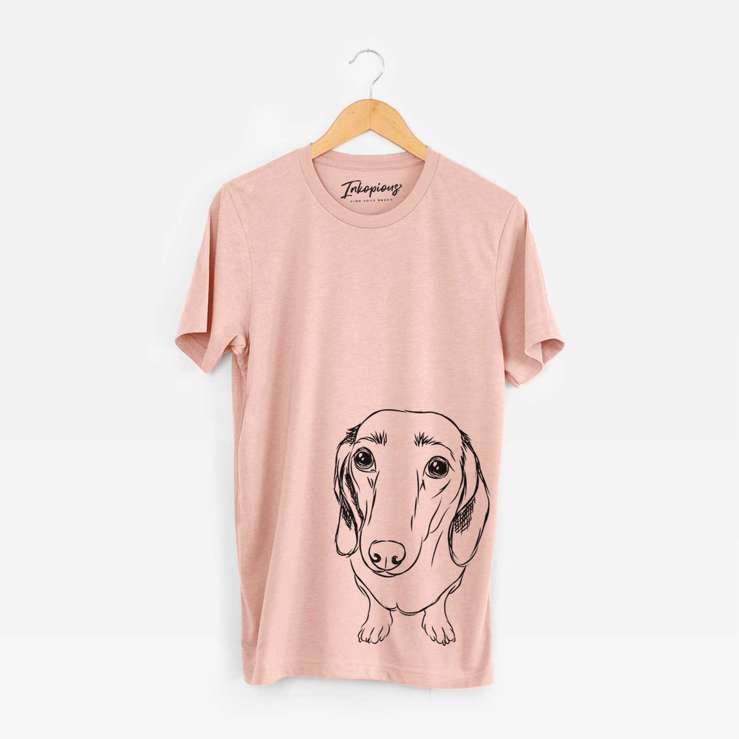 Hand-drawn sketch of Annabelle the Dachshund on a Peach Bella Canvas Unisex Crewneck