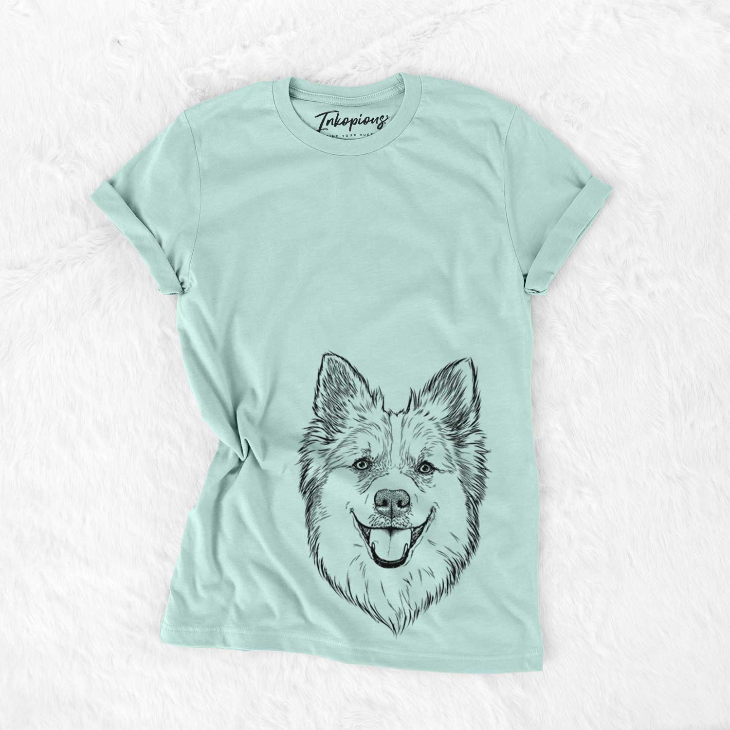 Hand-drawn sketch of Ari the Icelandic Sheepdog on a Heather Sage Unisex crewneck