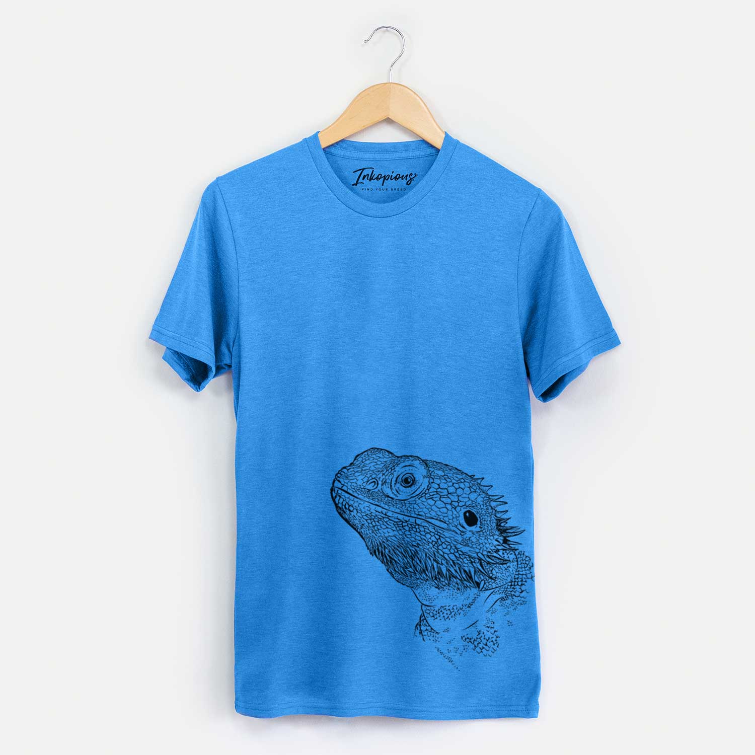 Hand-drawn sketch of Ash the Bearded Dragon on a Blue Bella Canvas Unisex Crewneck