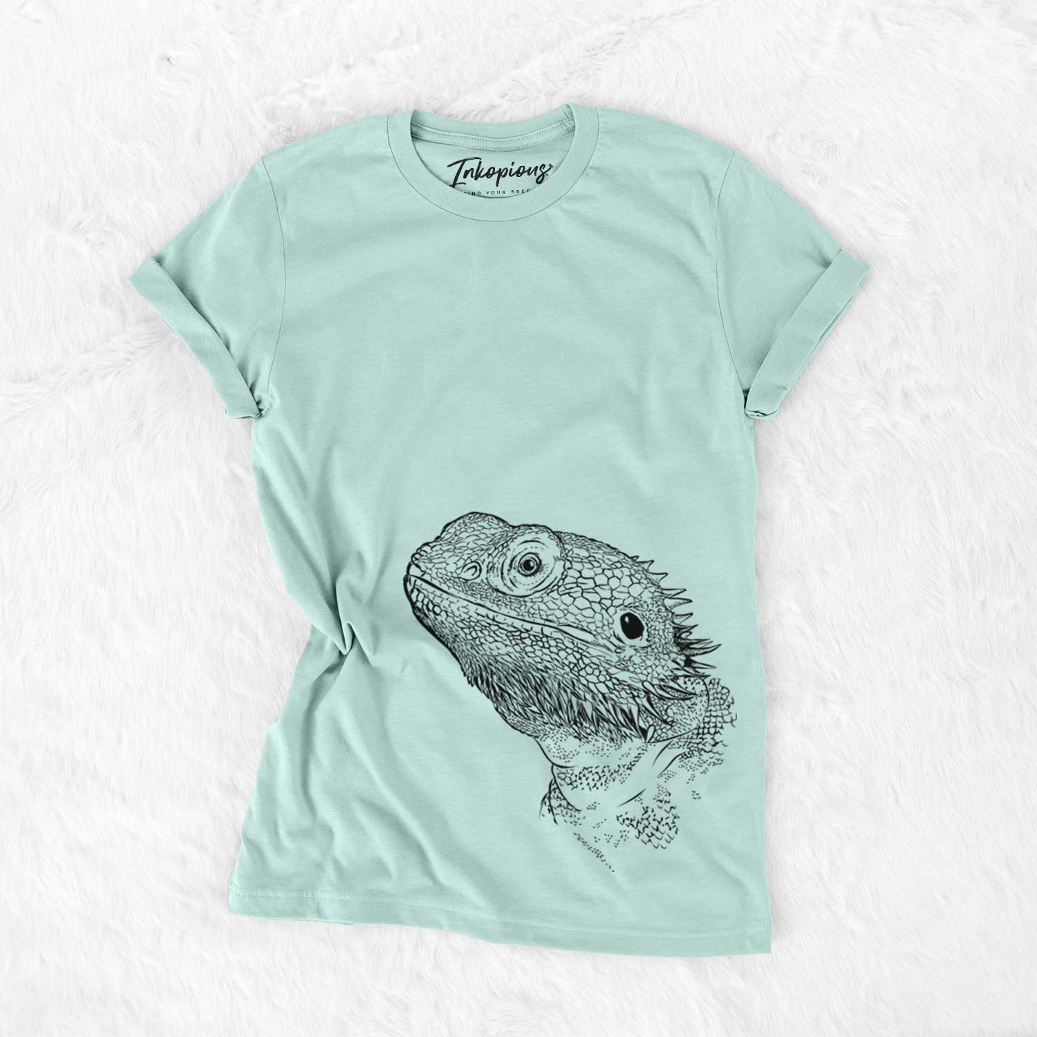 Hand-drawn sketch of Ash the Bearded Dragon on a Heather Sage Unisex crewneck