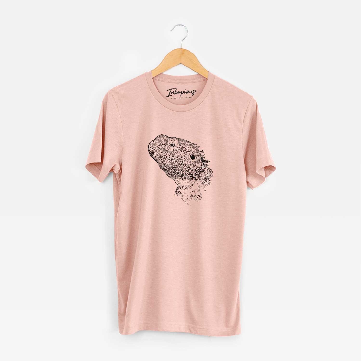 Hand-drawn sketch of Ash the Bearded Dragon on a Peach Unisex crewneck
