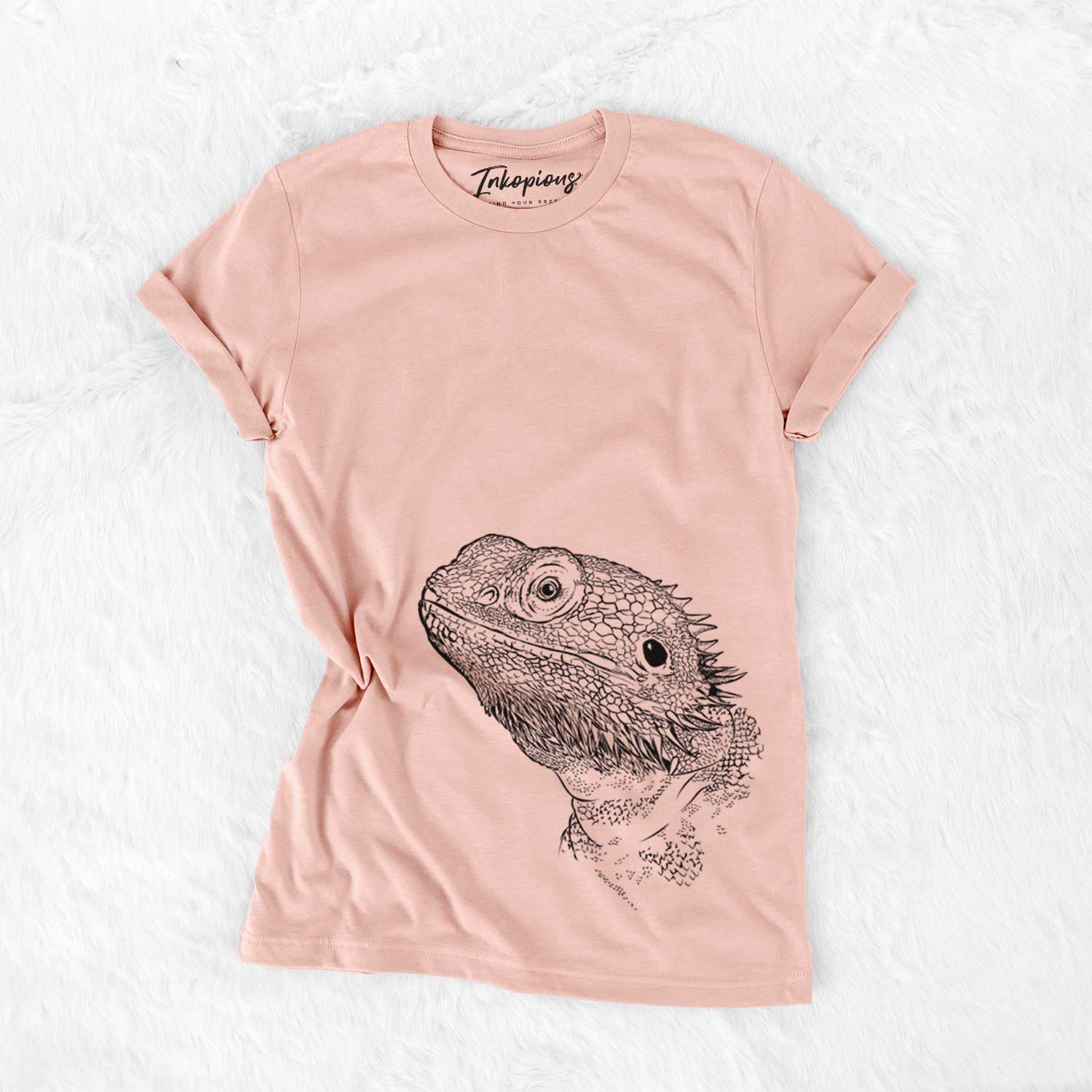 Hand-drawn sketch of Ash the Bearded Dragon on a Peach Bella Canvas Unisex Crewneck