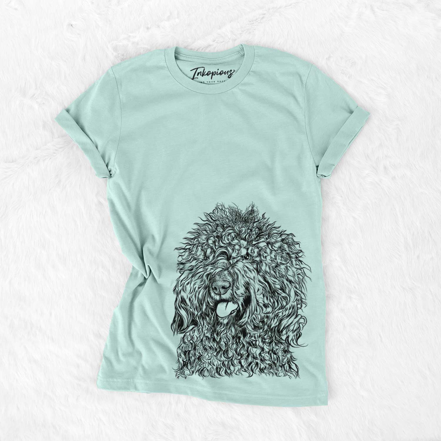 Hand-drawn sketch of Babs the Barbet on a Heather Sage Unisex crewneck